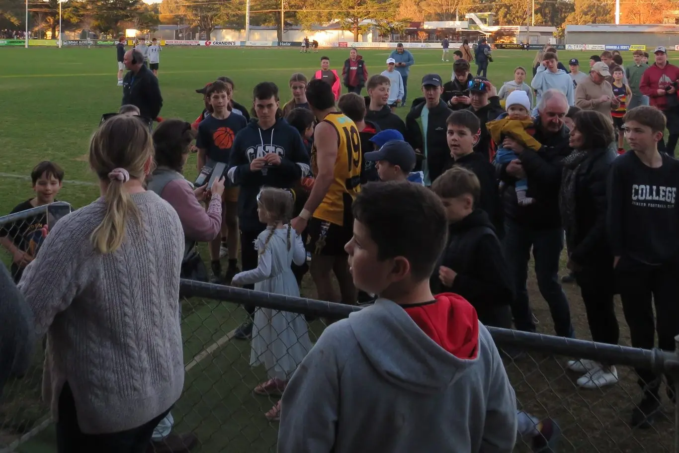 KING OF THE KIDS: Eddie Betts makes his way off the WJ Findlay Oval on Saturday, surrounded by young fans.  PHOTO: Simone Kerwin