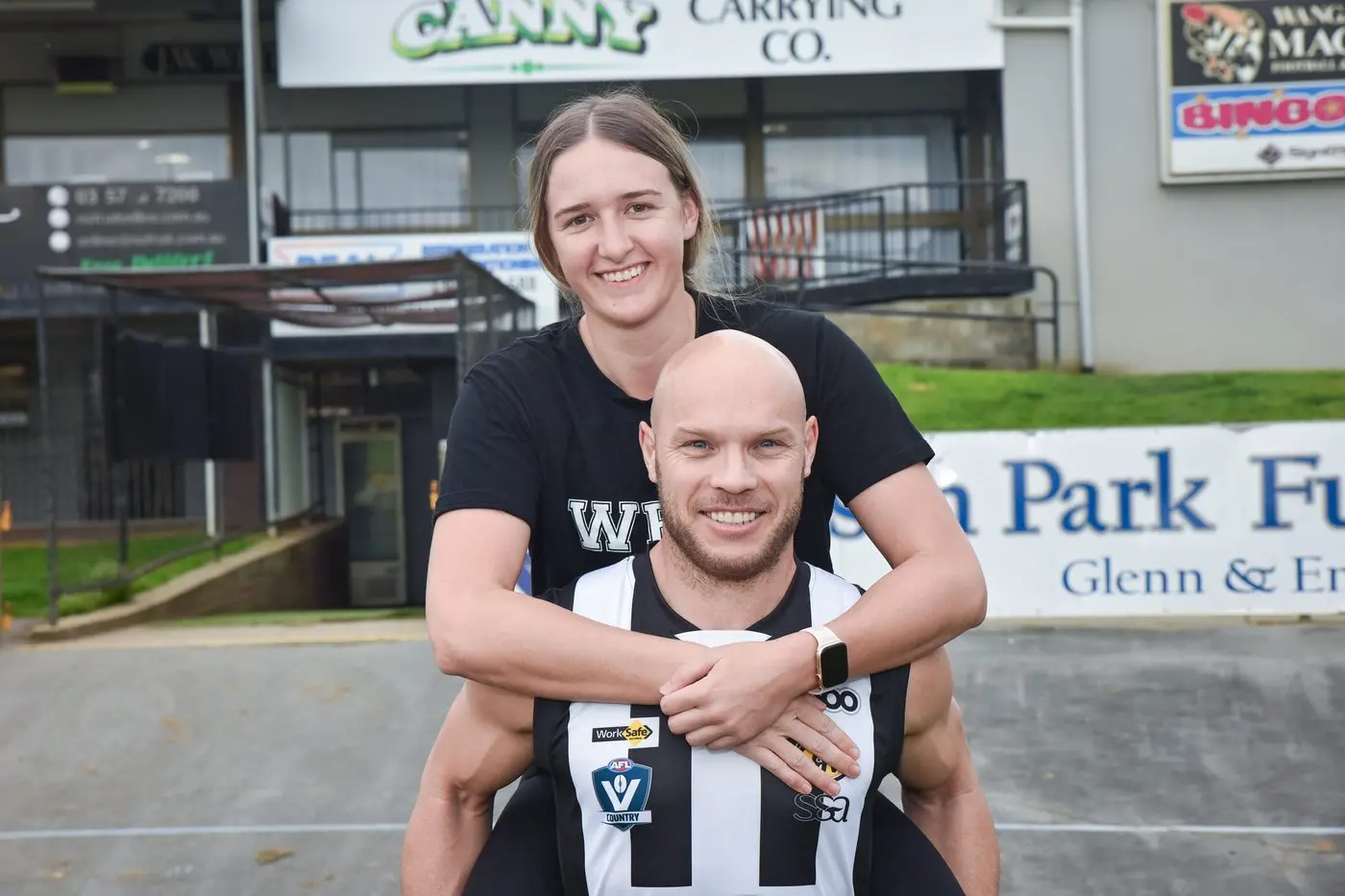 SHARED PASSION: Hannah Grady and Matt Kelly share a love of the black and white and understand what it takes to achieve the ultimate dream in their respective codes. PHOTO: Kurt Hickling Id:31211