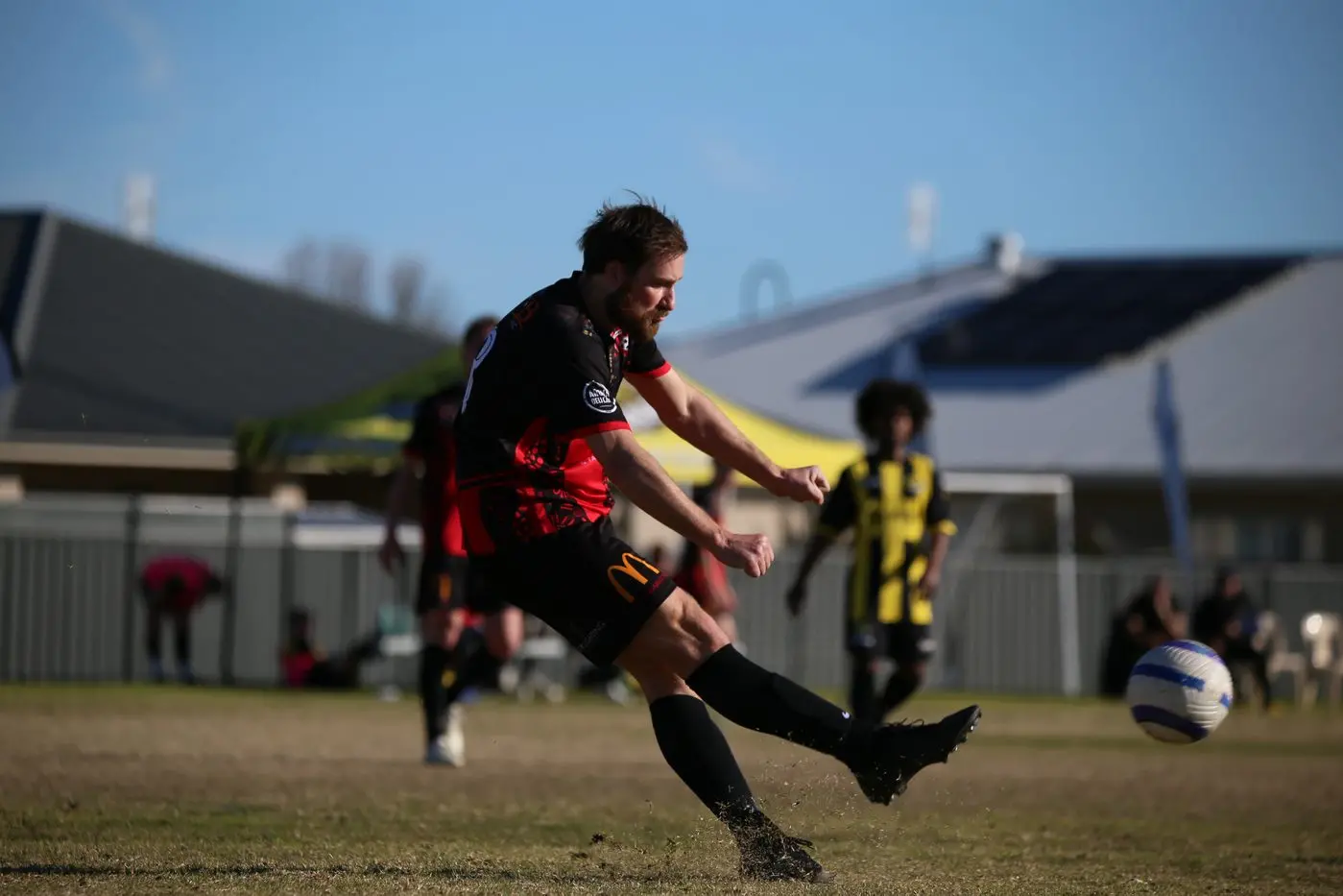 POWER: Brayden Gasperotti thumps the ball forward. PHOTOS: Kat De Naps Photography