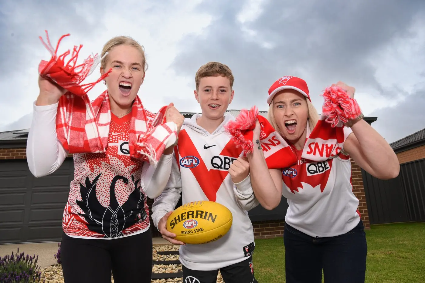 CHEER CHEER: Maya Ackroyd, Kobe Ackroyd and Kristen Ackroyd are excited to see the Swans shake down the thunder from the sky at tomorrow\\'s game. PHOTO: Kurt Hickling