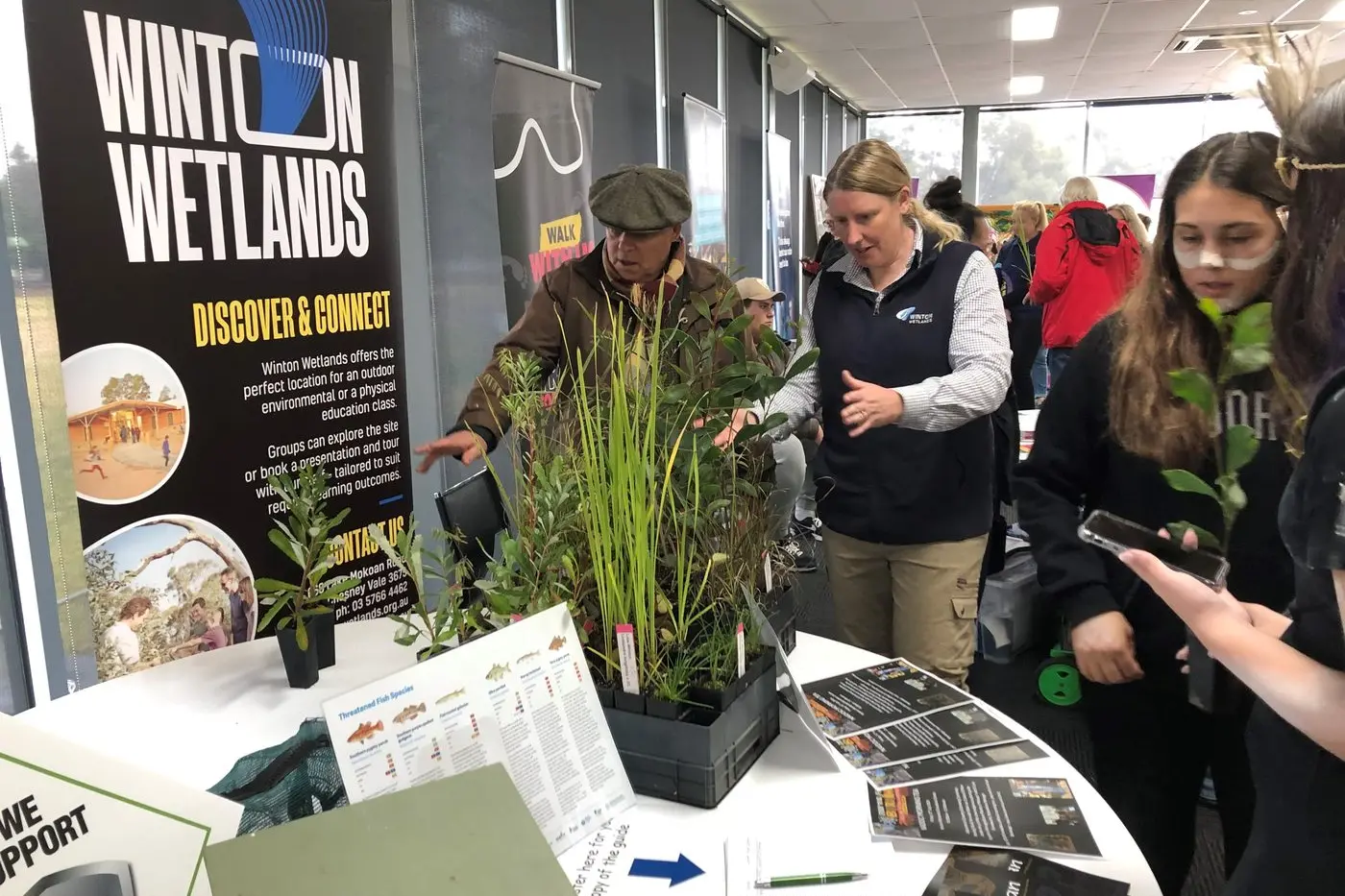 LOTS TO LEARN: Dr Lisa Farnsworth (centre), showcases a collection of native plants.