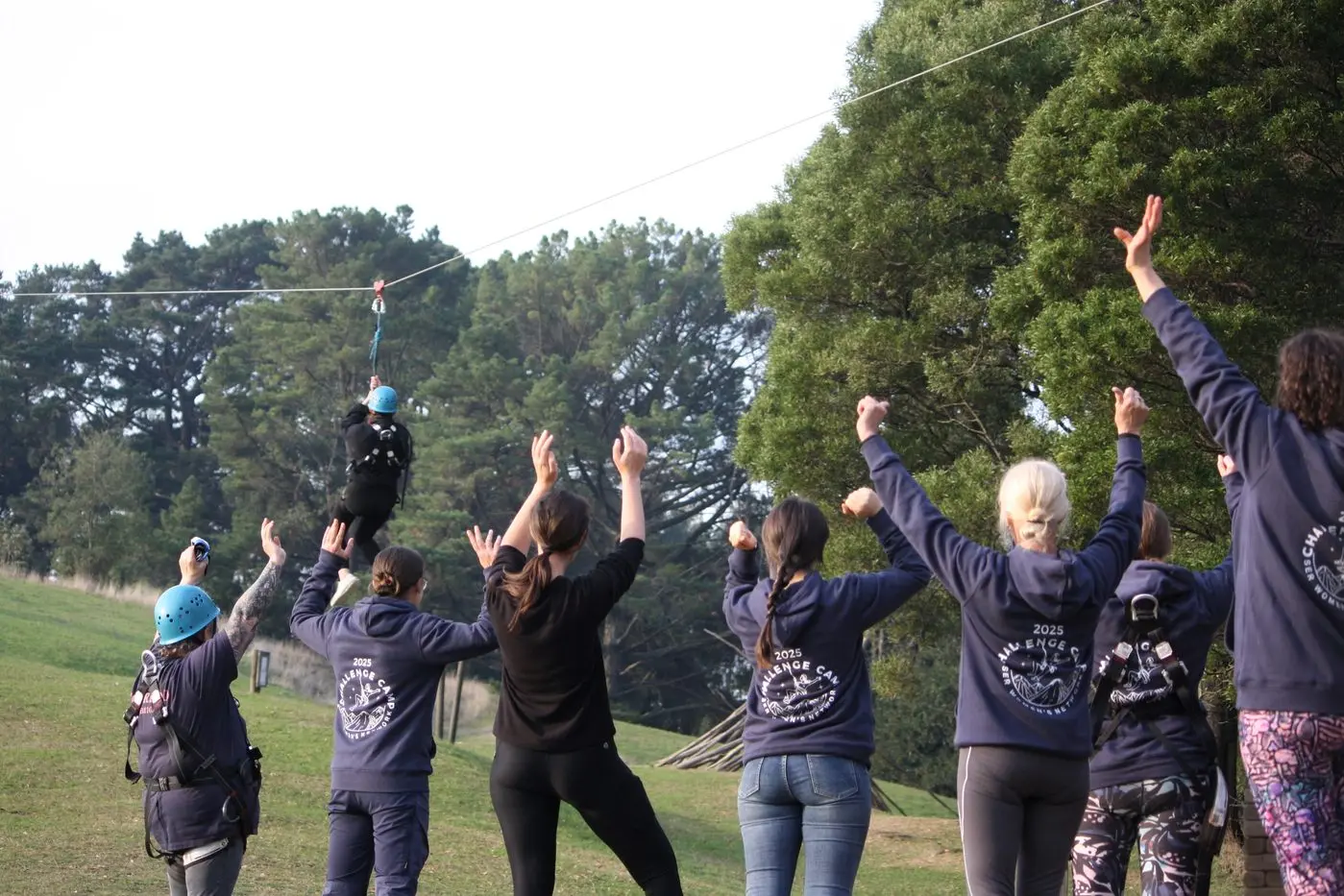 FLY HIGH: Several CFA members get involved in the flying fox activity at Allambee in early May.