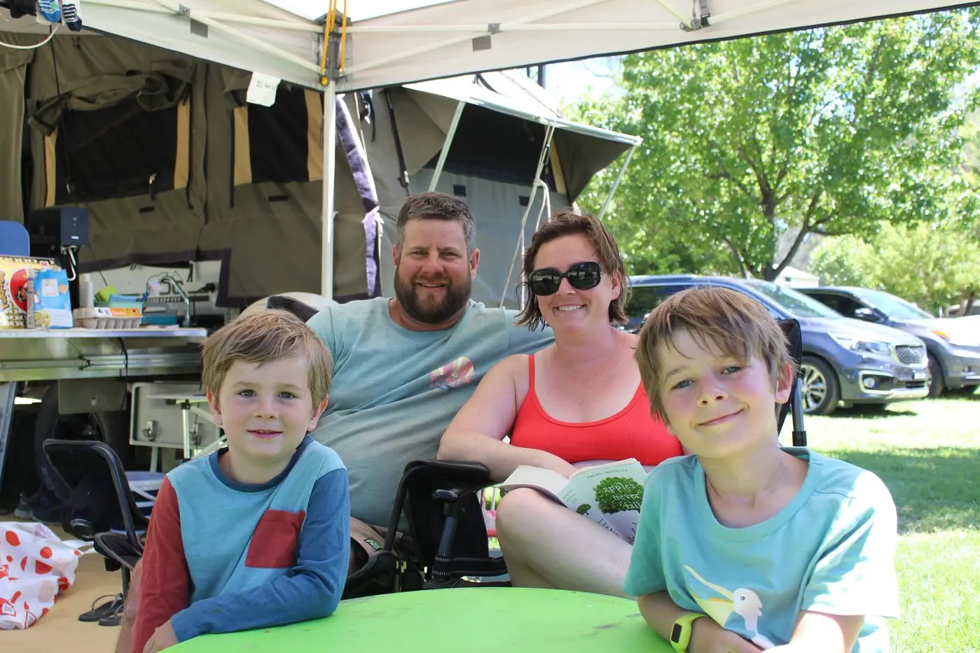 BASKING IN THE SUN: The Tasmanian based Breganti family of Jon, Ellen, Hamish and Noah, were among those relaxing at the Painters Island Caravan Park on Friday. PHOTO: Bailey Zimmermann Id:35742