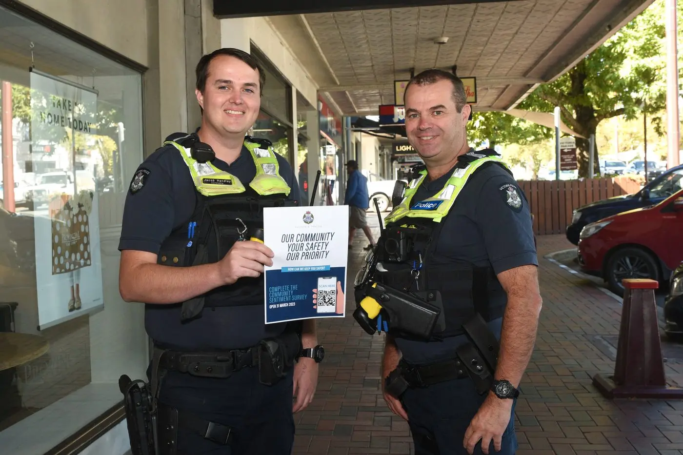 SEEKING FEEDBACK: Constable Jacob Handley and Senior Constable Mark Jensen took to the streets of Wangaratta on Thursday to raise awareness around the police Community Sentiment Survey. PHOTO: Kurt Hickling Id:39927