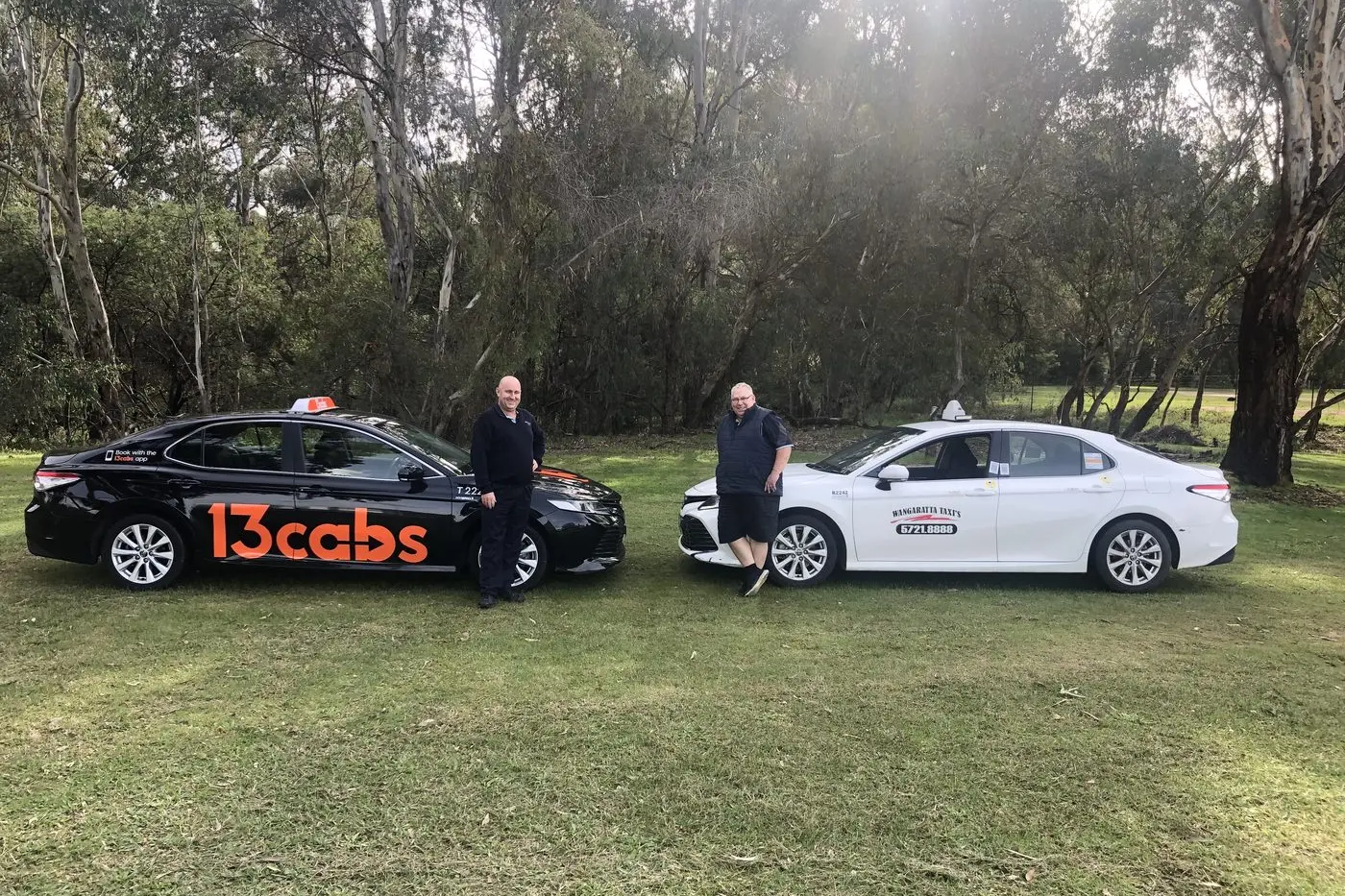 CALL A CAB: (From left) Wangaratta Taxis spokesperson Glen Beard, with taxi driver Ken Larkings, said the 13cabs booking system will improve passenger service.  Id:26259