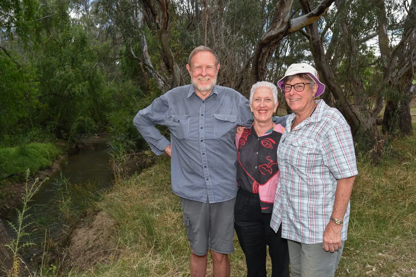 WORK TO BE DONE; Wangaratta Landcare and Sustainability members John Naylor, Mary Reid and Libby Smith were delighted to have received funding for three separate projects in the Glenrowan Solar Farm 2023 community-driven benefit sharing program, including works at this section of Three Mile Creek. PHOTO: Kurt Hickling