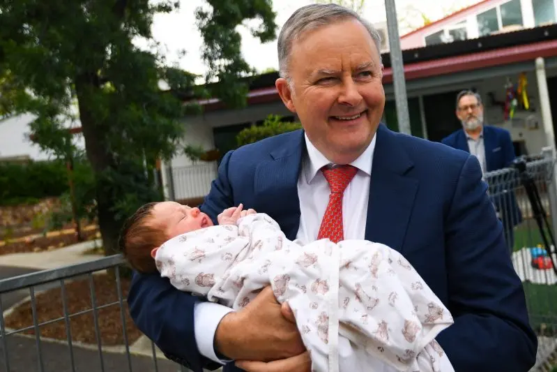 LEFT HOLDING THE BABY: Australian Opposition Leader Anthony Albanese holds 3- week old Elena in his hands during a visit to Cottage Child Care Centre in Canberra on Friday. \\nPHOTO: (AAP Image/Lukas Coch) 