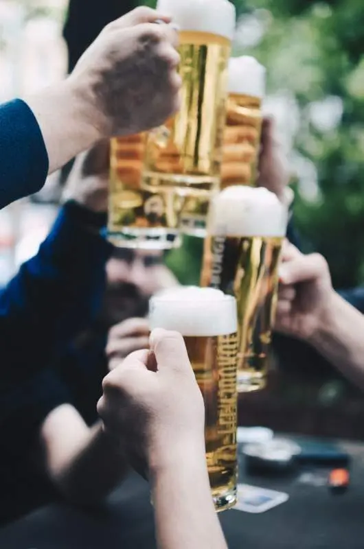 CHEERS: Beer will be flowing again at public bars and cinemas will also open, as two of the restrictions being lifted from next Monday. PHOTO: Quentin Dr on Unsplash