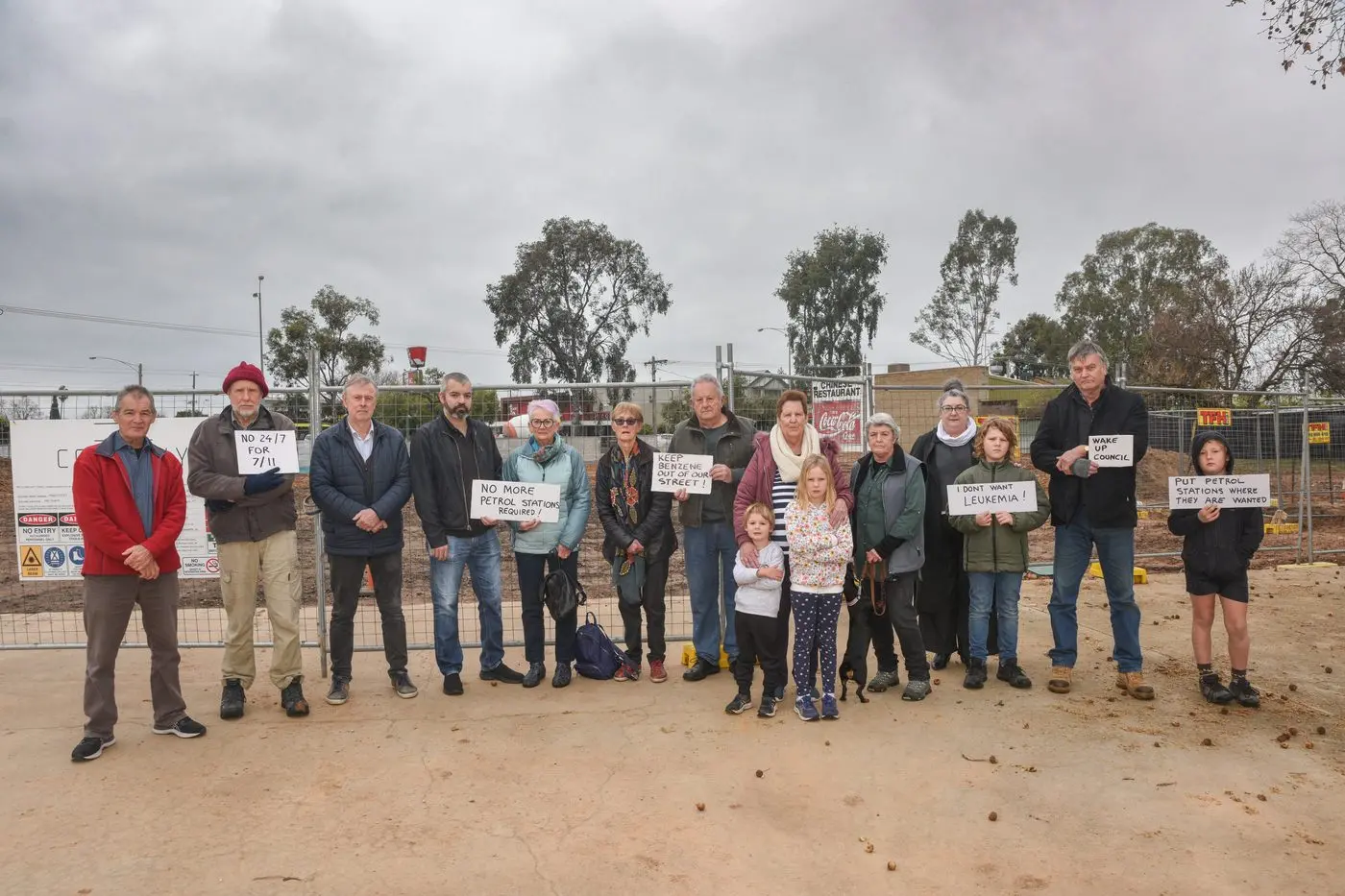 THEY WERE UP FOR THE FIGHT: Local residents two years ago holding placards in protest about plans to build a 7-Eleven service centre at the corner of Ryley and Perry streets.