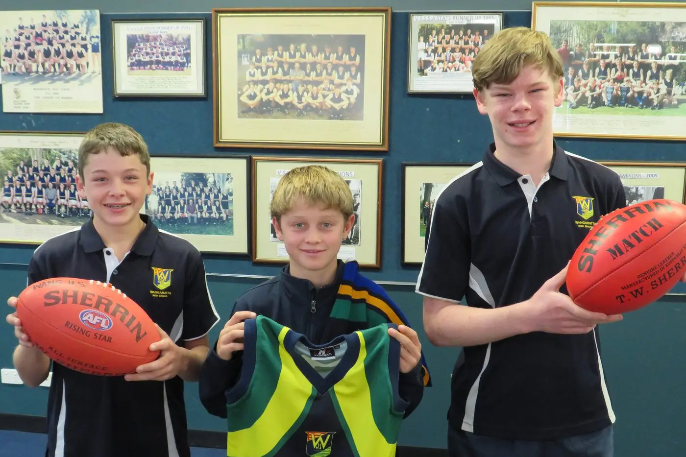CONTINUING THE LINE: Wangaratta High School year seven footballers Lane Sloan, Angus Fraser and Mason Skermer are part of a proud footy tradition which is being explored as sports coordinator Jud Mullins compiles a team of former WHS students. PHOTO: Simone Kerwin
