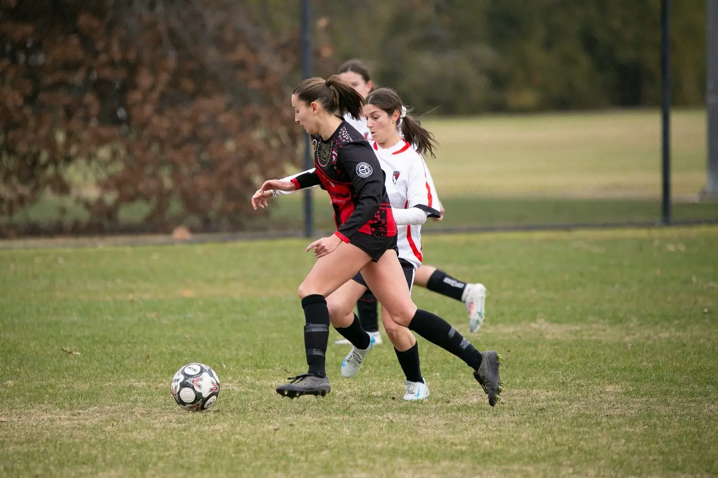 MOVING FORWARD: Hannah Swindley looks to bring the ball up the field in the Lady Devils\\' 1-10 loss to Boomers. PHOTOS: Kat De Naps Photography