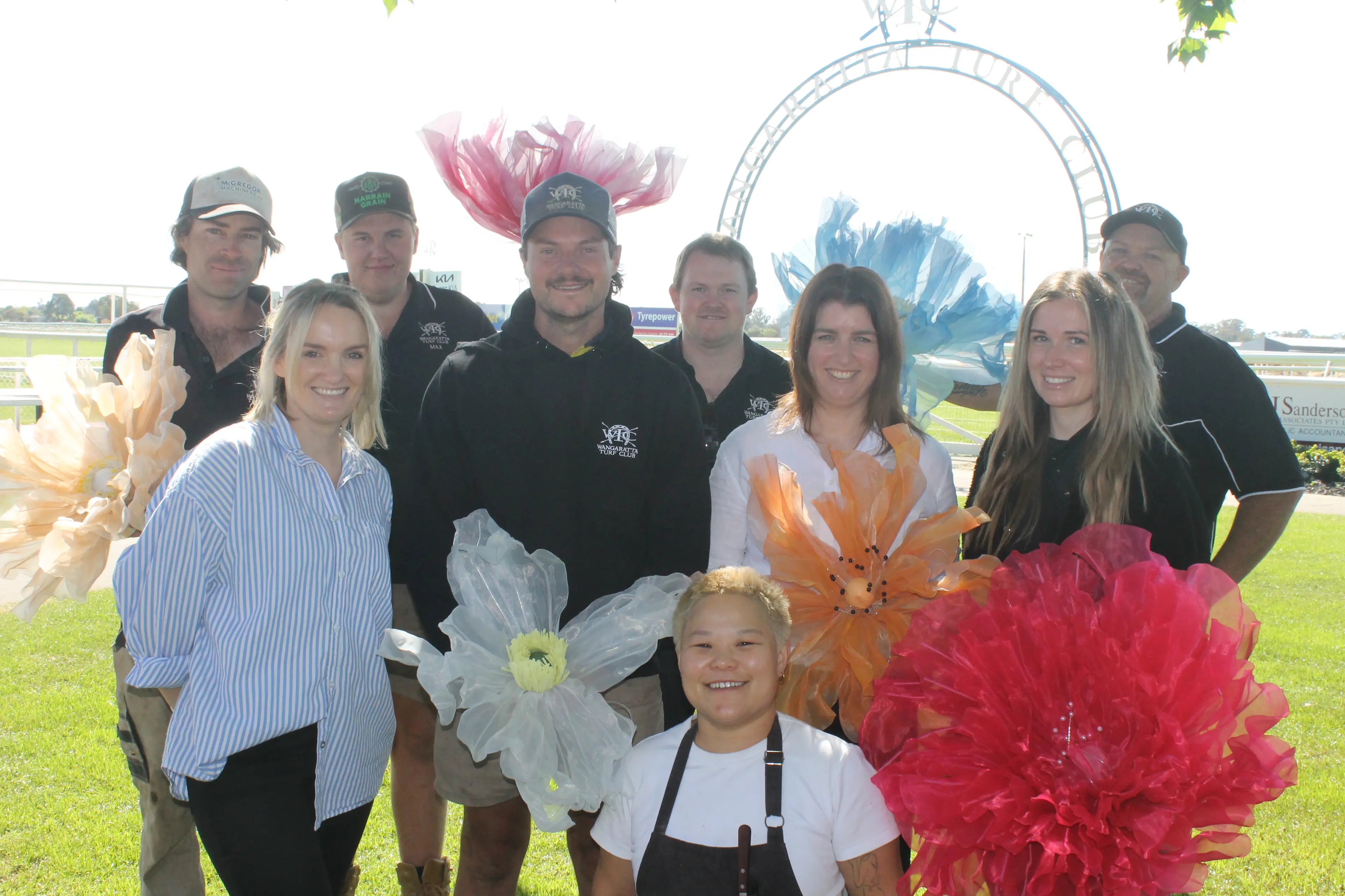<p>IN FULL BLOOM: Wangaratta Turf Club team members (back from left) Sam Johns, Max Buckley, Lachlan Hart, Greg Brown, (middle from left) Emma Merlo, Josh Chambers, Courtney Purcell, Mel Gilfuis, and Enos Feng (front) are eager to welcome racegoers to the Melbourne Cup Day Races on Tuesday, 4 November. PHOTO: Nathan de Vries</p>\\n