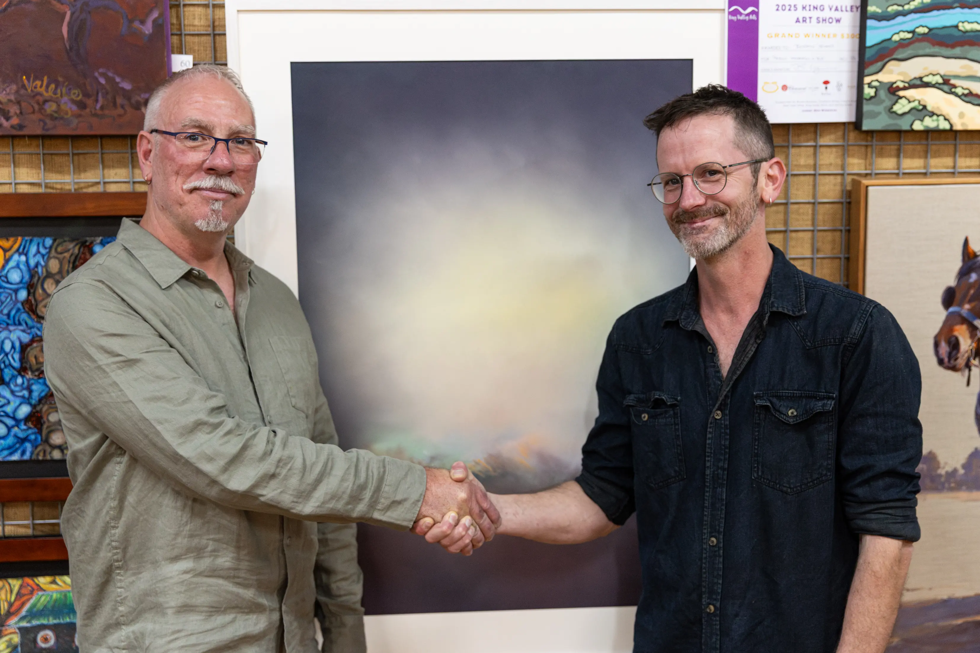 <p>GRAND WINNER: Judge Ben Winspear with grand winner Ben Jenkins, who was awarded $3000 for his artwork \\'Tiepolo progression in blue\\'. PHOTO: Marc Bongers</p>\\n
