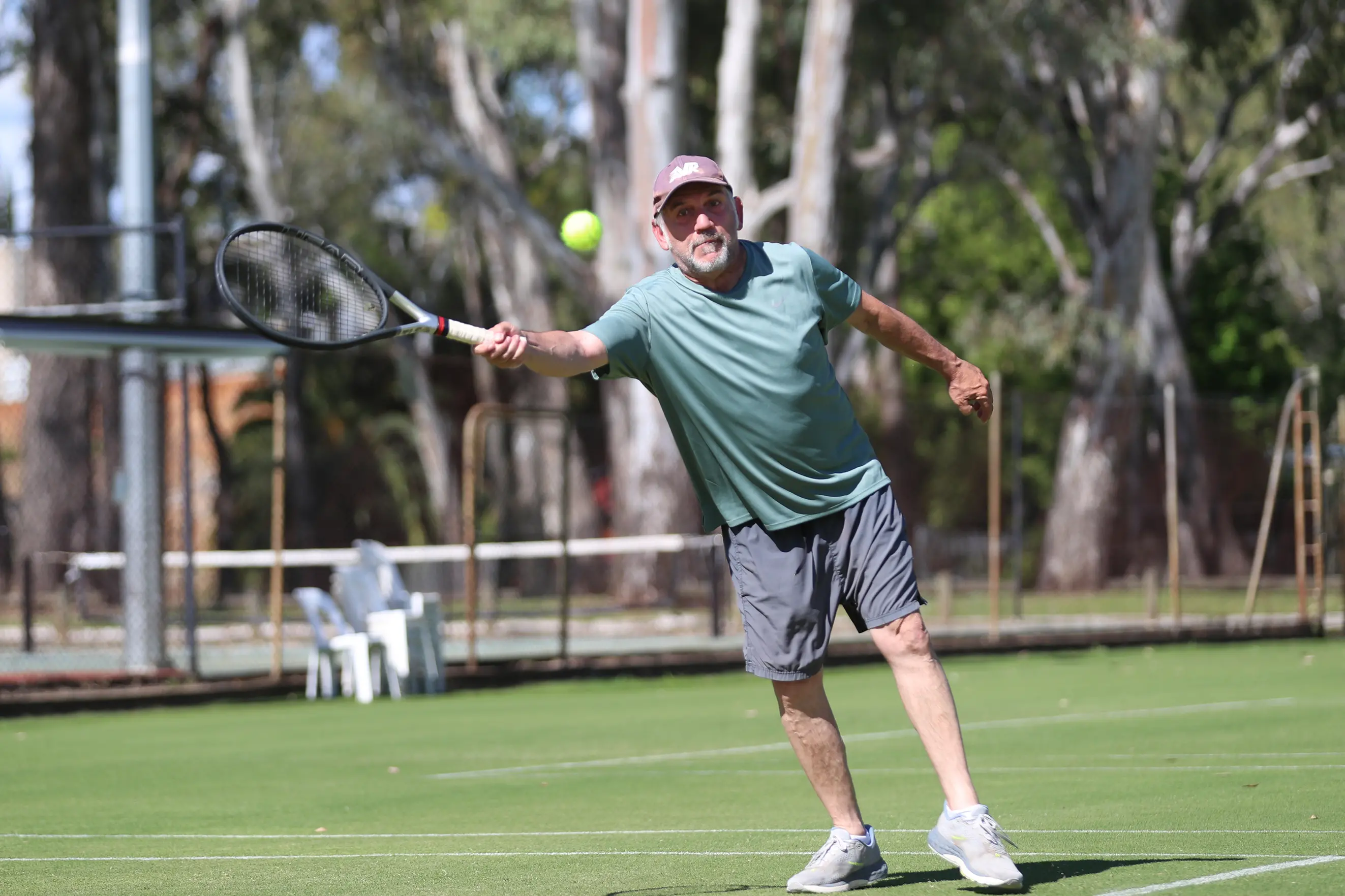 <p>FULL STRETCH: Carl Cutrona extends to reach the ball in his aggregate tennis match at Merriwa Park on Saturday. PHOTO: Melissa Beattie</p>\\n