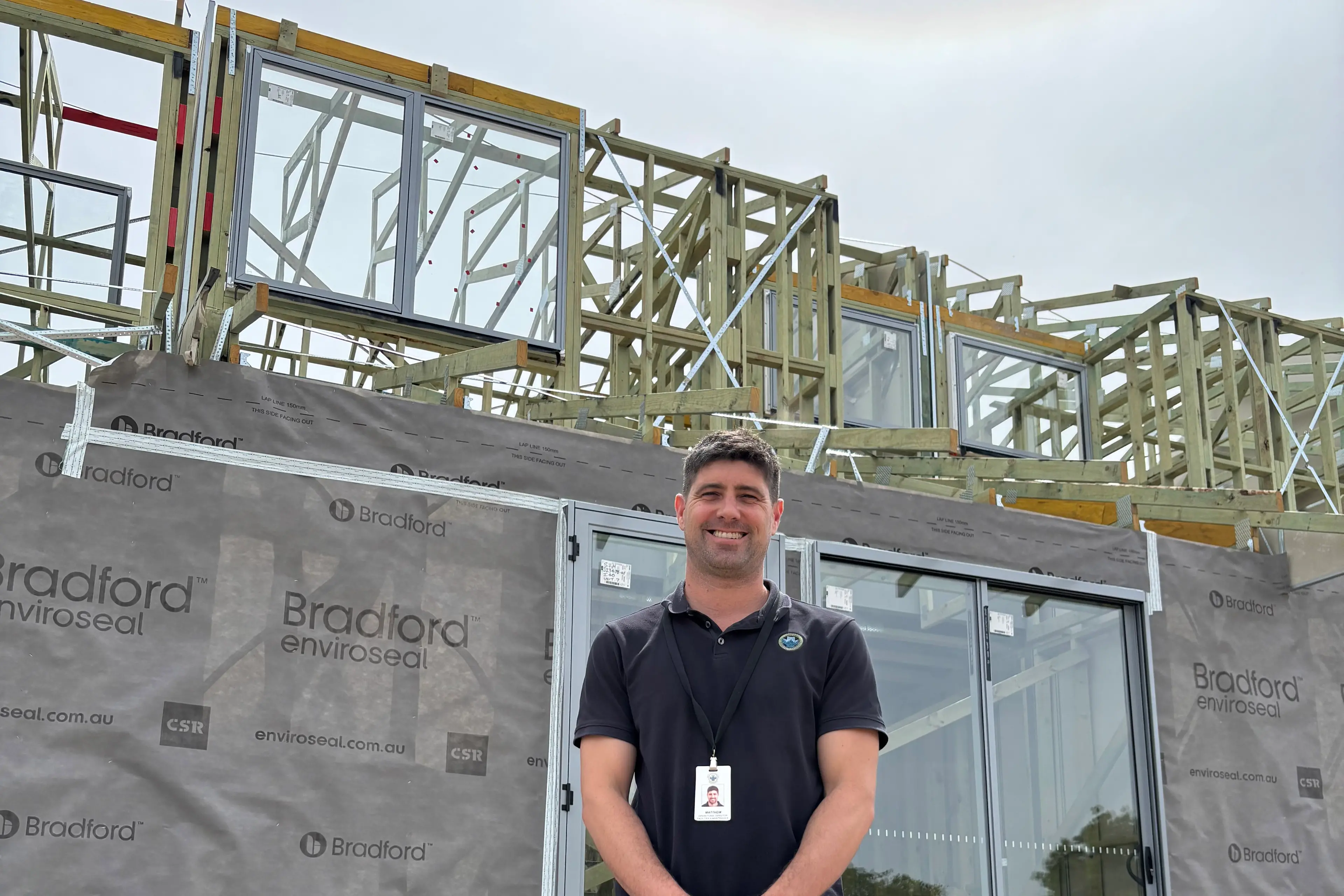 <p>TAKING SHAPE: Matthew Charleston, operational director of NHW\\'s facilities and maintenance department, inspects the completion of framing works at the new housing development in Dixon Street.</p>\\n