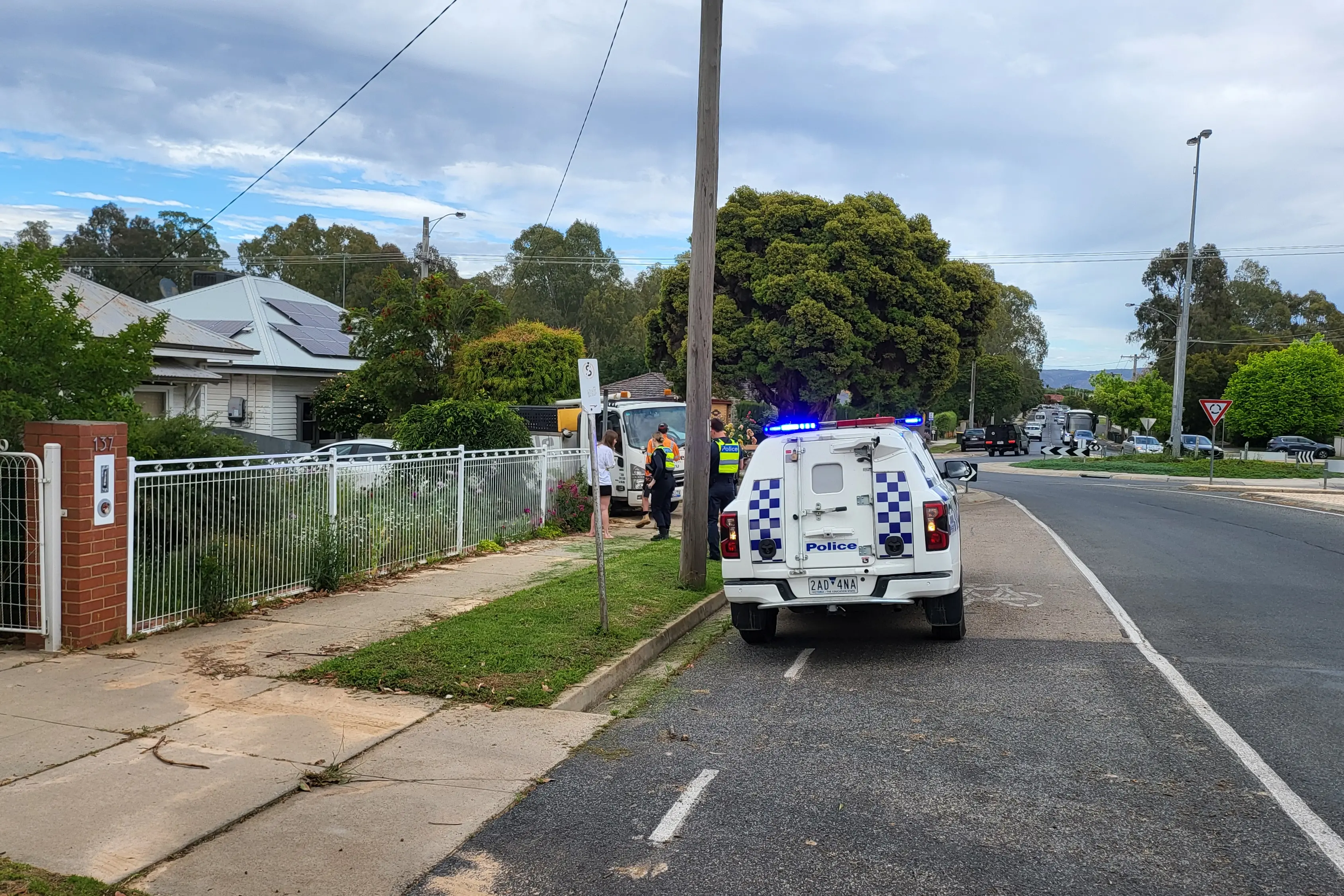 <p>MINOR DAMAGE: Police attend the scene of an accident on Rowan Street on Friday morning where an unoccupied light-truck has ploughed into a car parked in a residential driveway. </p>\\n