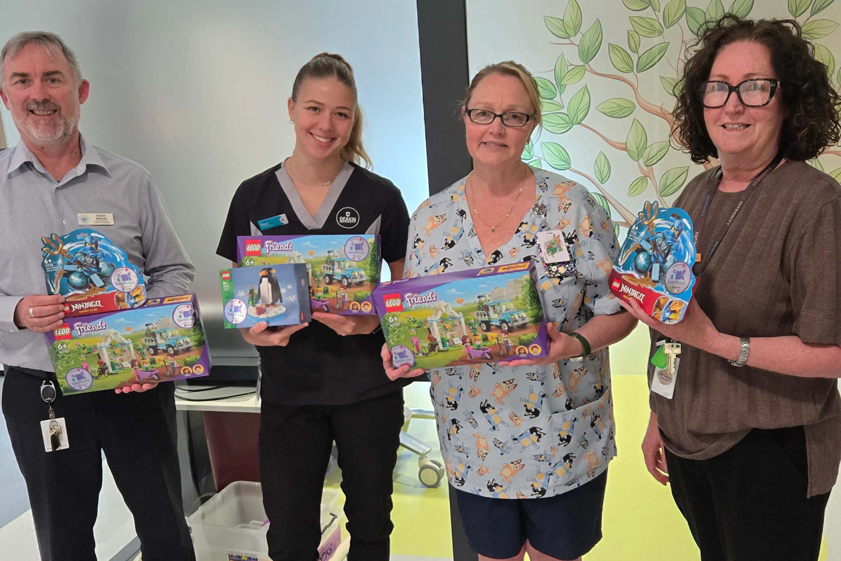 <p>5FUN AND GAMES: Northeast Health Wangaratta executive team members Andrew Nitschke and Kim Bennetts (right), and paediatric team members Rosa Vickers (centre, left) and Cassie Buchanan with the LEGGO donations.</p>\\n
