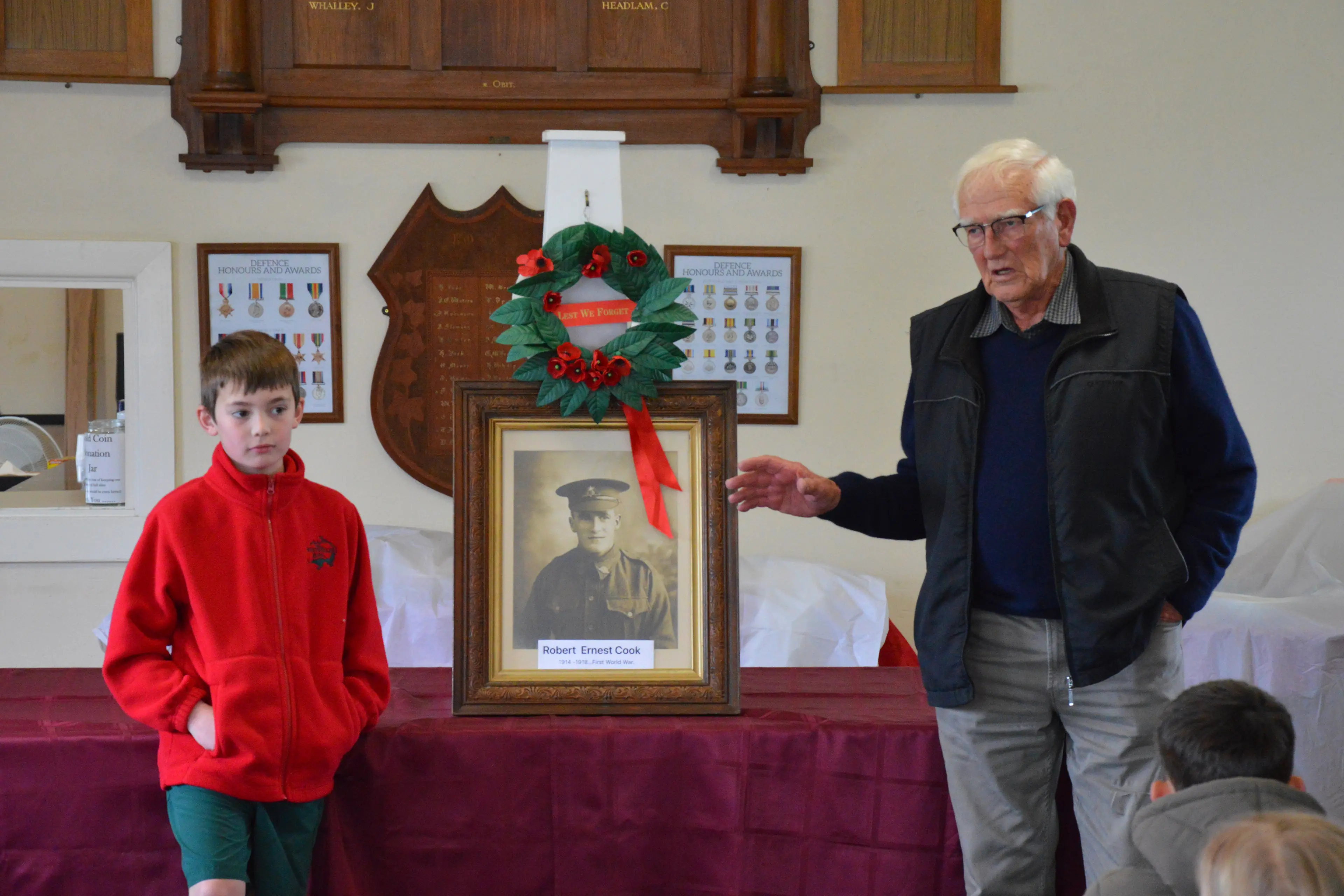 <p>FAMILY CONNECTION: Whitfield District Primary School student Wilson, with grandfather Robert Cook and a photograph of their ancestor Robert Ernest Cook, who served in World War I, was a reminder of the legacy left by those who served. PHOTO: Anita McPherson</p>\\n