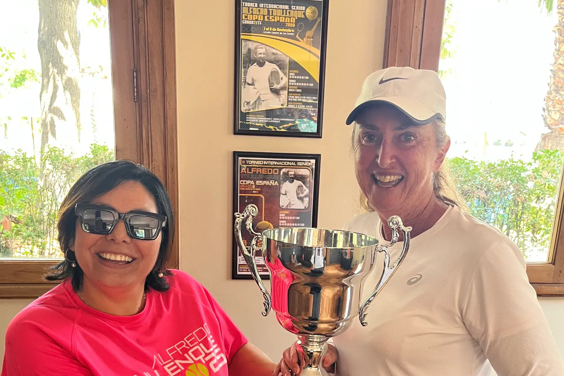<p>SILVERWARE: Michelle Hill (right) receives the trophy following her tournament win in Santiago, Chile.</p>\\n