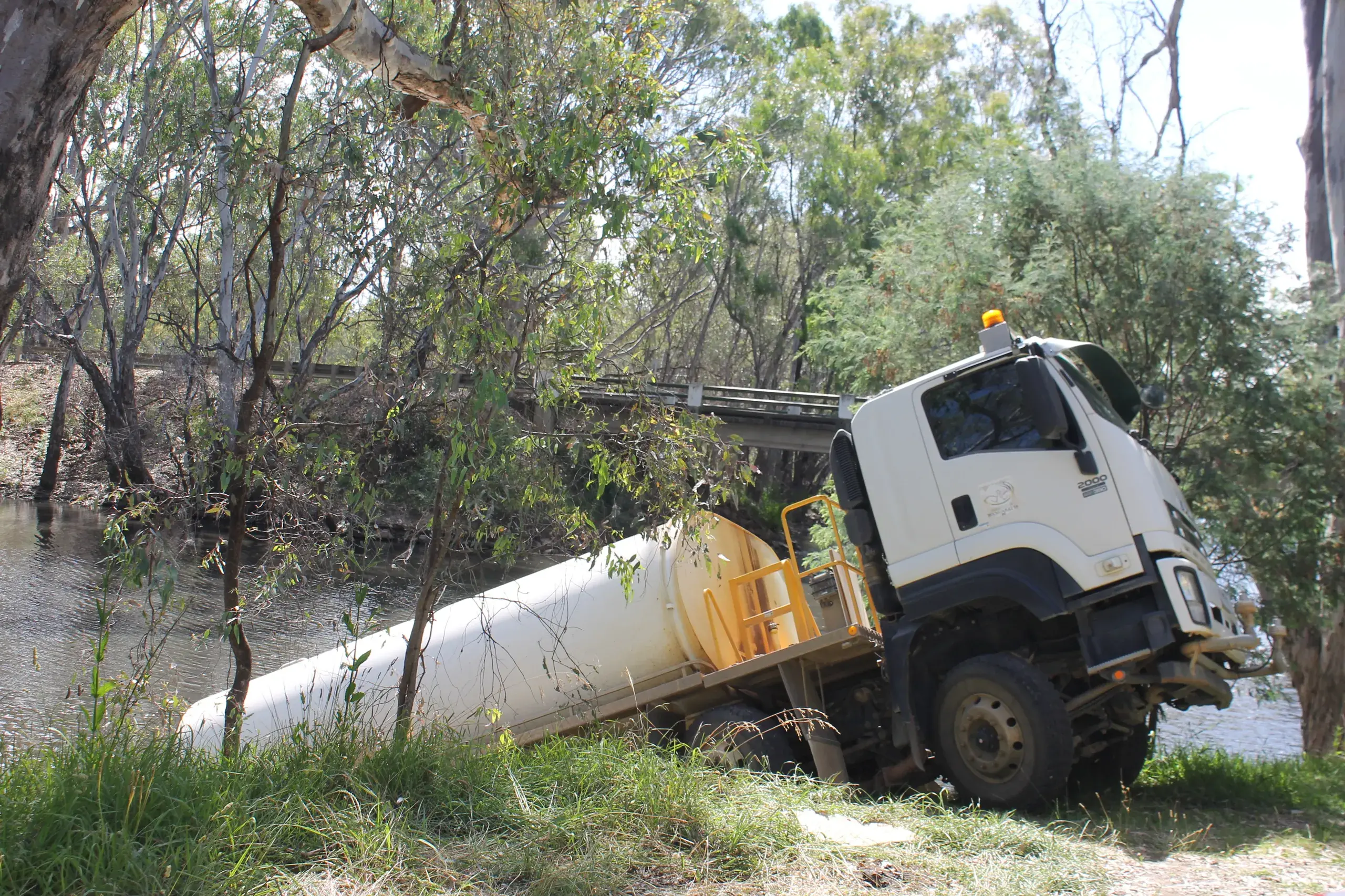 <p>BOGGED DOWN: A water tanker fell into a creek just off Bowser Road on Thursday afternoon, where a council worker was hospitalised for a broken foot. PHOTO: Bailey Zimmermann</p>\\n
