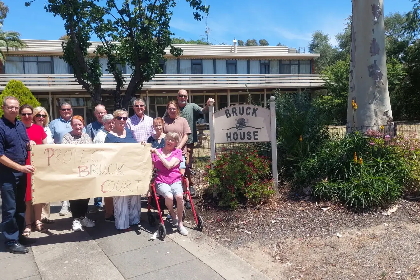 <p>HOLDING ONTO HISTORY: A group of people passionate about protecting the architectural history of the Bruck buildings have objected to a proposal by Bruck Textiles to demolish the caretaker quarters built in the 1950s. Pictured are (from left) Hamish McPherson, Lea Campbell, Danny Potter, Lorraine Monshing, Colin Atkin, Ann Shaw, Heather Potter, Tony Isaacson, Chris Spencer, Bev Hardisty, Carol White and Grant White.</p>\\n