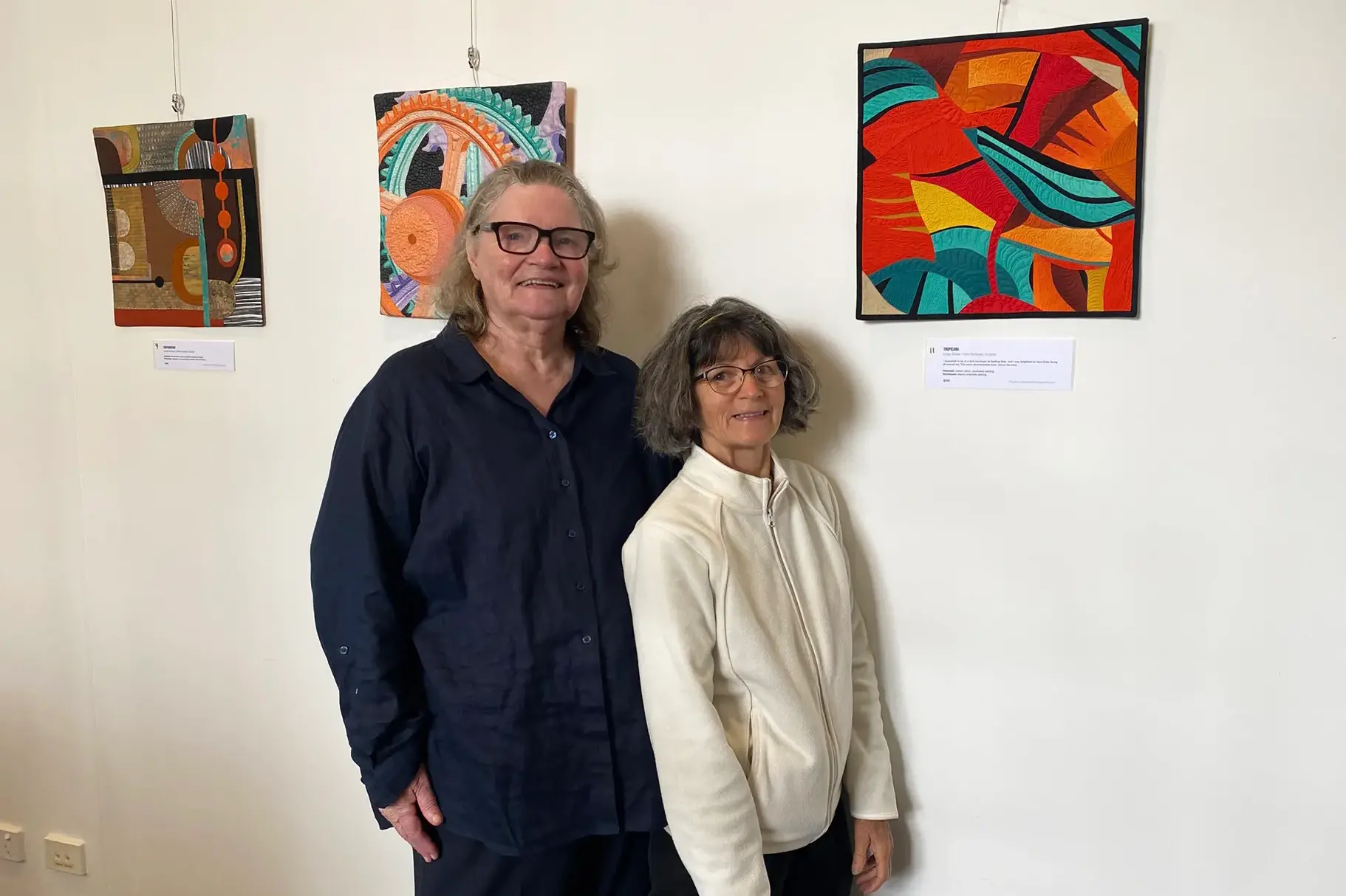 <p>DIVERSE COLLECTION: Local quiltmakers Kerryn Taylor and Andrea Busst take a closer look at Tropicana by Linda Steele, on display in the Bainz Gallery at Wangaratta Library. PHOTO: Jordan Duursma</p>\\n