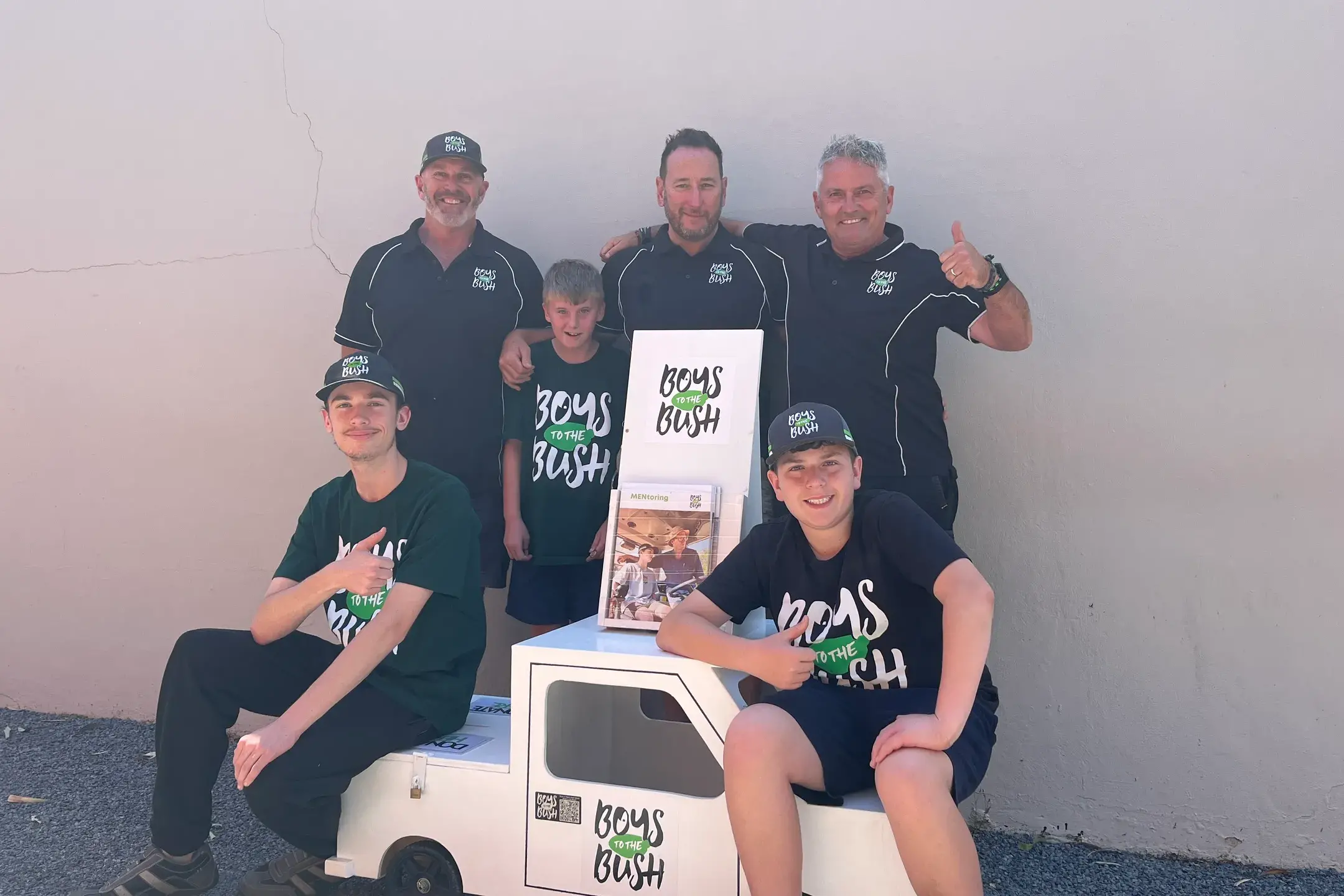 <p>WELCOME ASSET: Craig Green (back, from left), Zane Bishop, Brad Burgan, Peter Rourke, Jak Beeson and Noah Montgomery are excited to see community support grow with this new promotional car donated by the Men\\'s Shed. PHOTO: Grace Fredsberg</p>\\n
