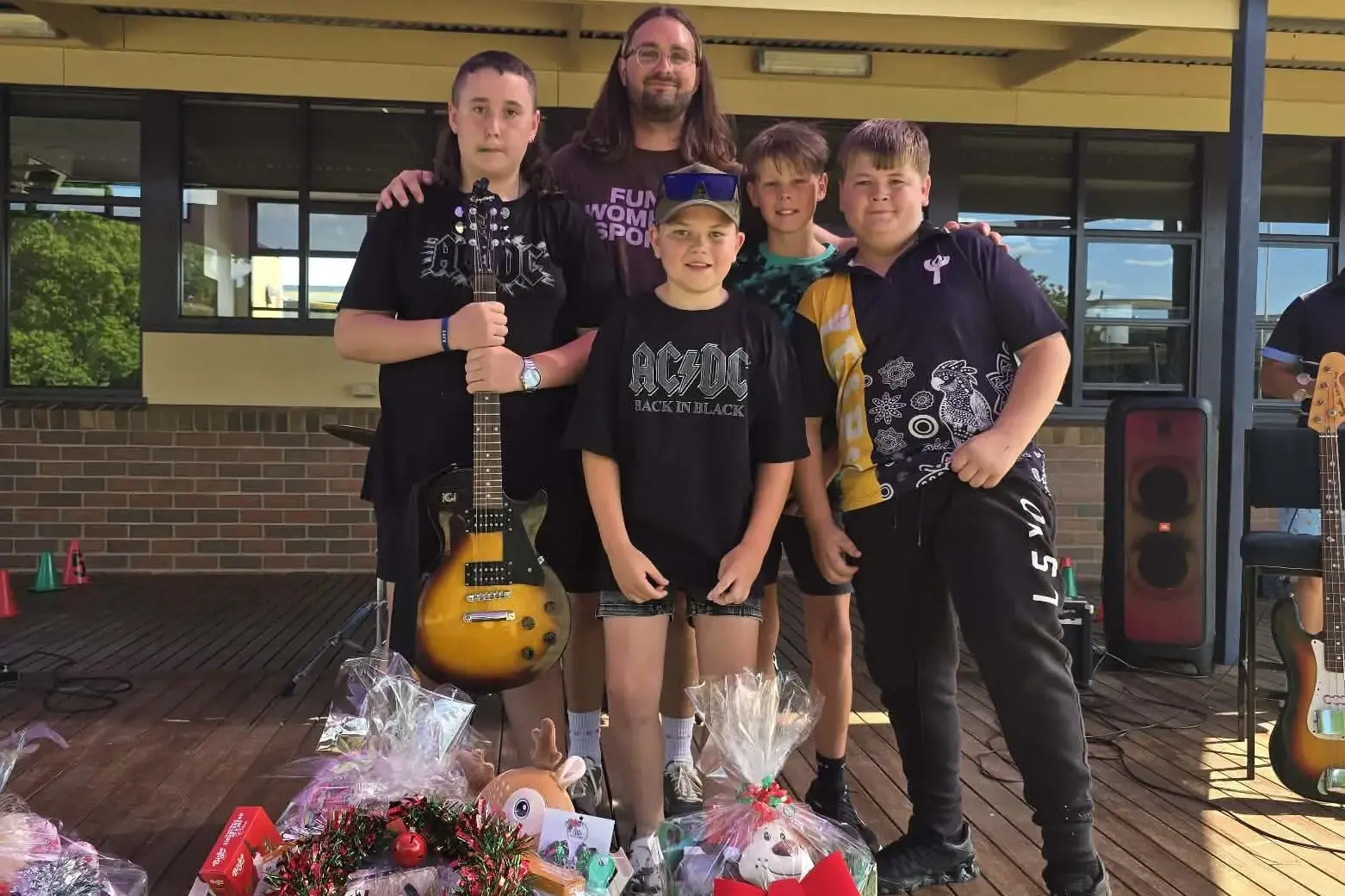 <p>ROCK AND ROLL: Brand-new Yarrunga Primary School band, Fusewire (Caden Longman, band teacher Ollie Morton-Rodaro, Zac Sayers, Jordan Woodrow and Rydah Donovan) lit up the stage during their debut performance.</p>\\n