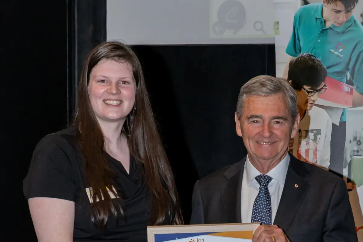 <p>HONOURED: Aleeta Carmody (left) is presented with the In2Science Regional Connection Award by the Honourable Professor John Brumby AO. PHOTO: House Studios</p>\\n