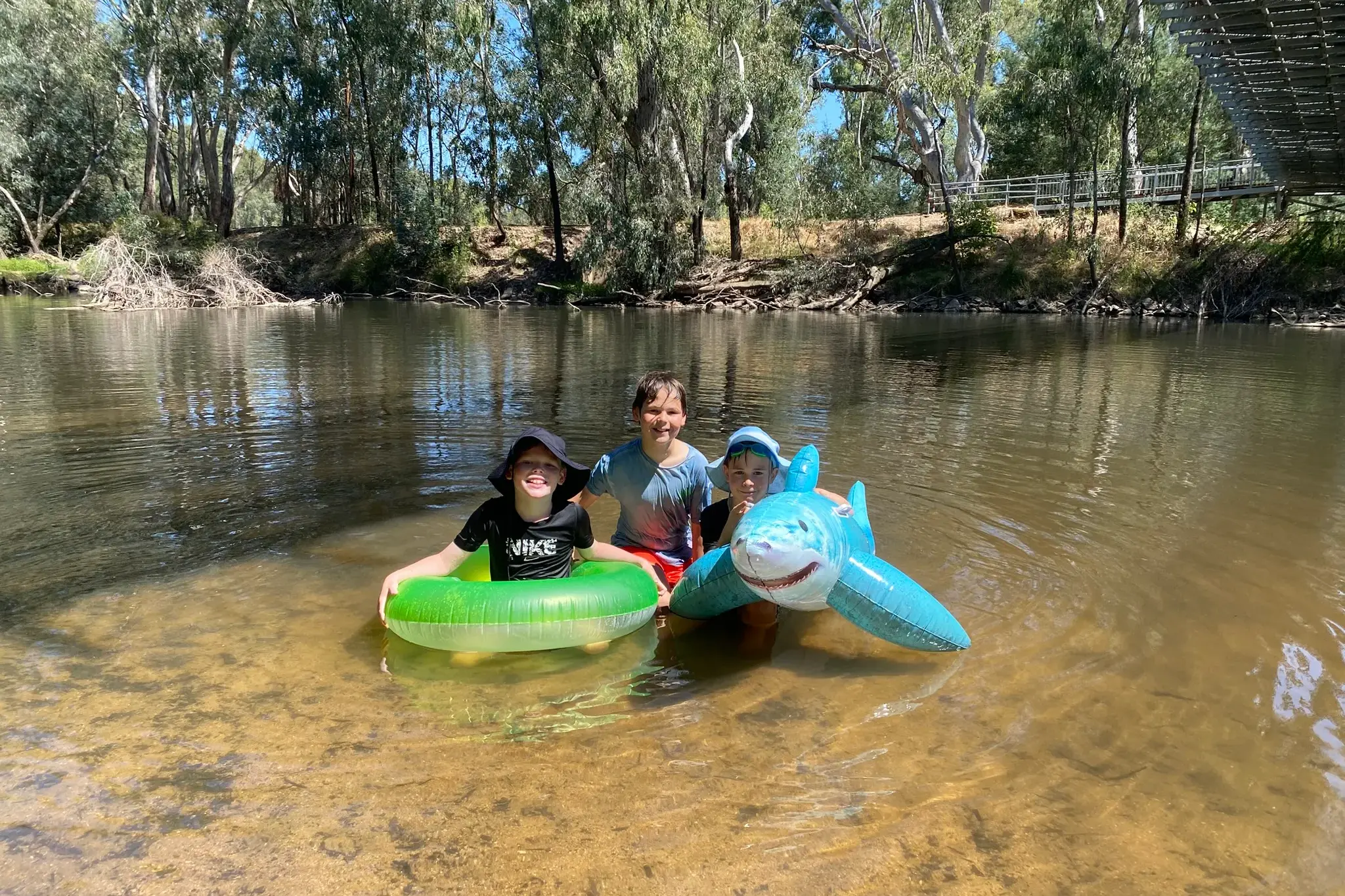 <p>COOLING OFF: Brothers, Mason (9), William (11) and Harry Cook (7), spent Monday cooling off at the Sydney Beach alongside other families. Local swimming holes, splash parks and pools are expected to be bustling with families as Wangaratta faces a severe heatwave warning with temperatures to reach mid forties through the week. PHOTO: Jordan Duursma </p>\\n