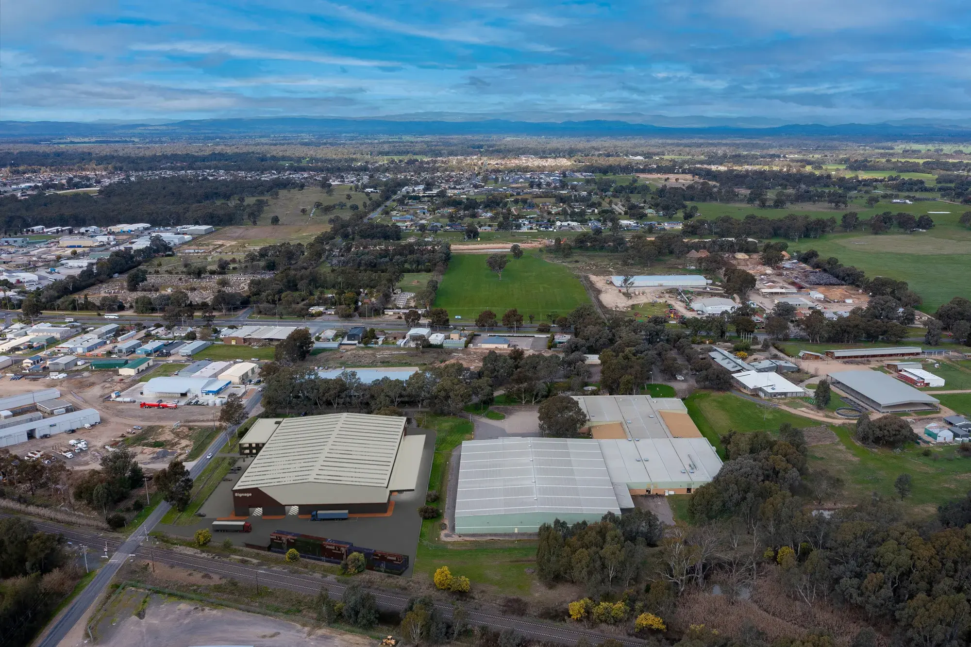 <p>ON THE MARKET: An artists impression a potential warehouse [pictured to the left] next to the existing 15,702m2 building on Shanley Street. A permit has approved for further development on the site.</p>\\n