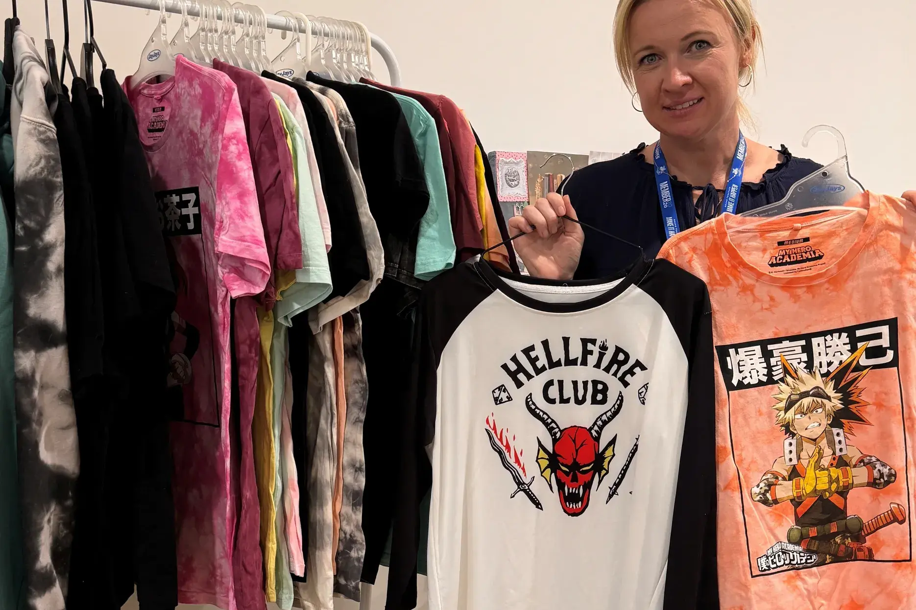 <p>LOTS TO SEE: Rural City of Wangaratta\\'s Bree Cashman shows some of the t-shirts available on the clothes racks at Synergy Youth Hub for local young people.  The hub will reopen for 2026 on Monday, 19 January.</p>\\n