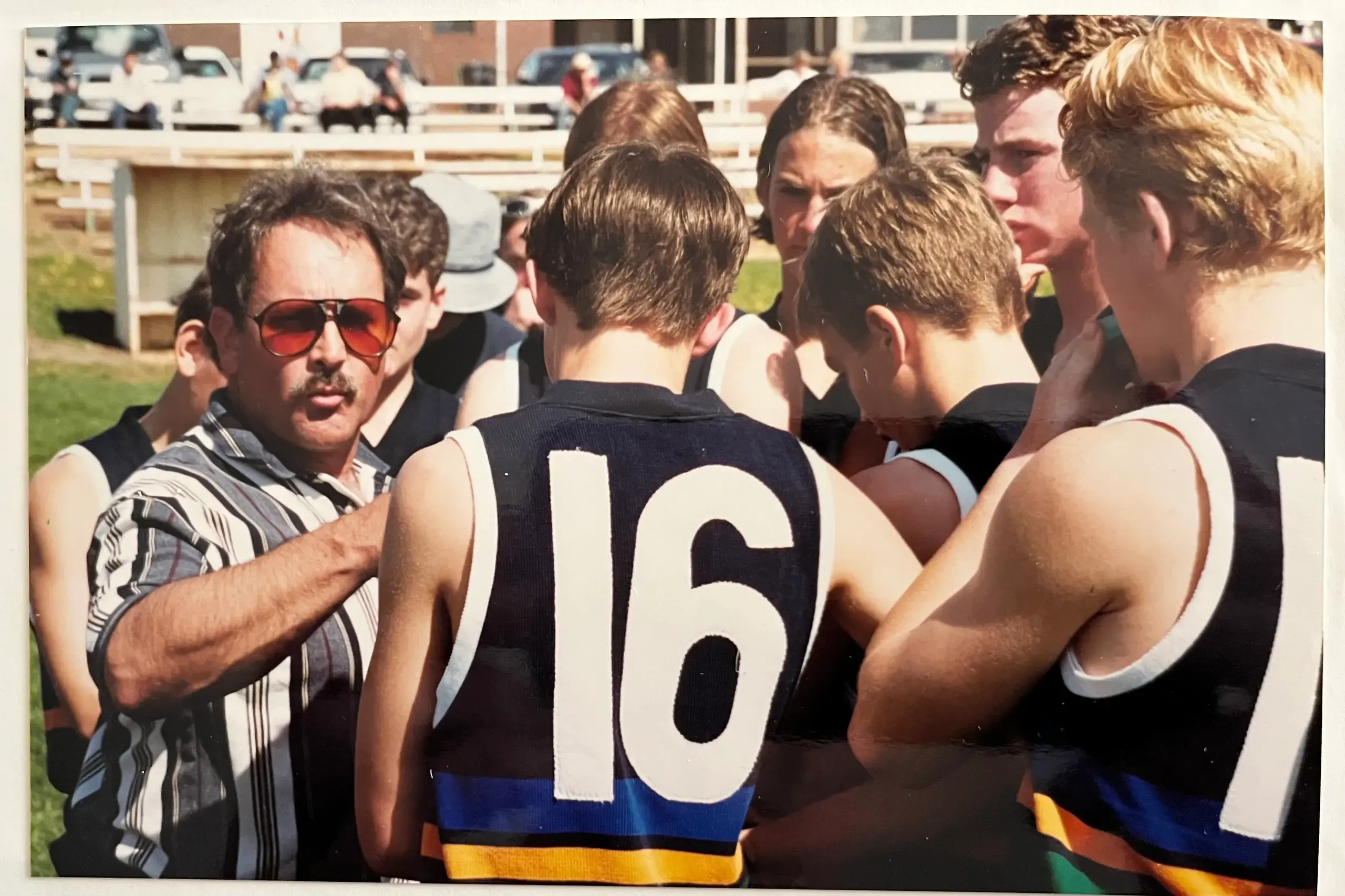 <p>GUIDING LIGHT: John Evans addresses his troops during the 1999 state final, one of three titles won by Wangaratta High School when he was coach.</p>\\n
