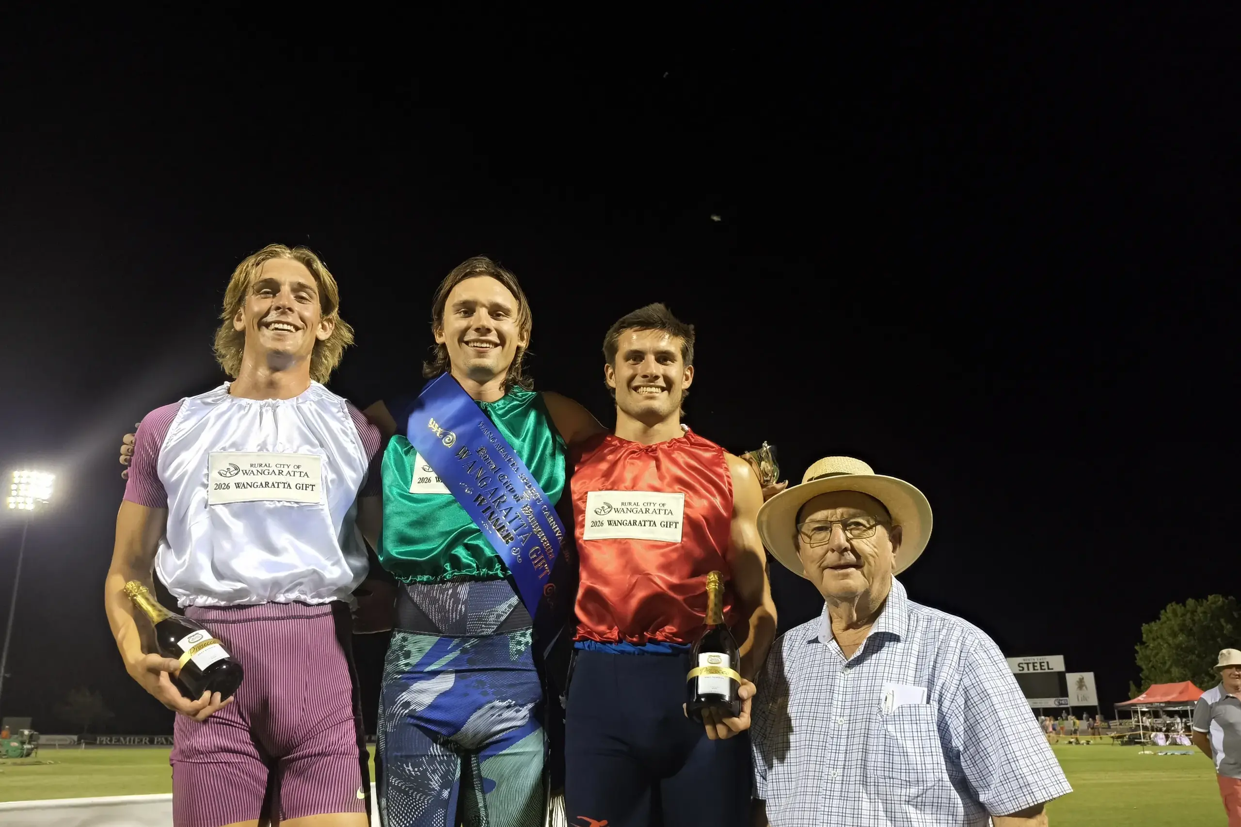<p>ON TOP OF THE DAIS: Wangaratta Men\\'s Gift place getters (from left) Brodie Smith (third), Tom Perry (first) and Hayden Anderson (second) with Cr Harvey Benton who presented the trophy. PHOTO: Shane Douthie</p>\\n