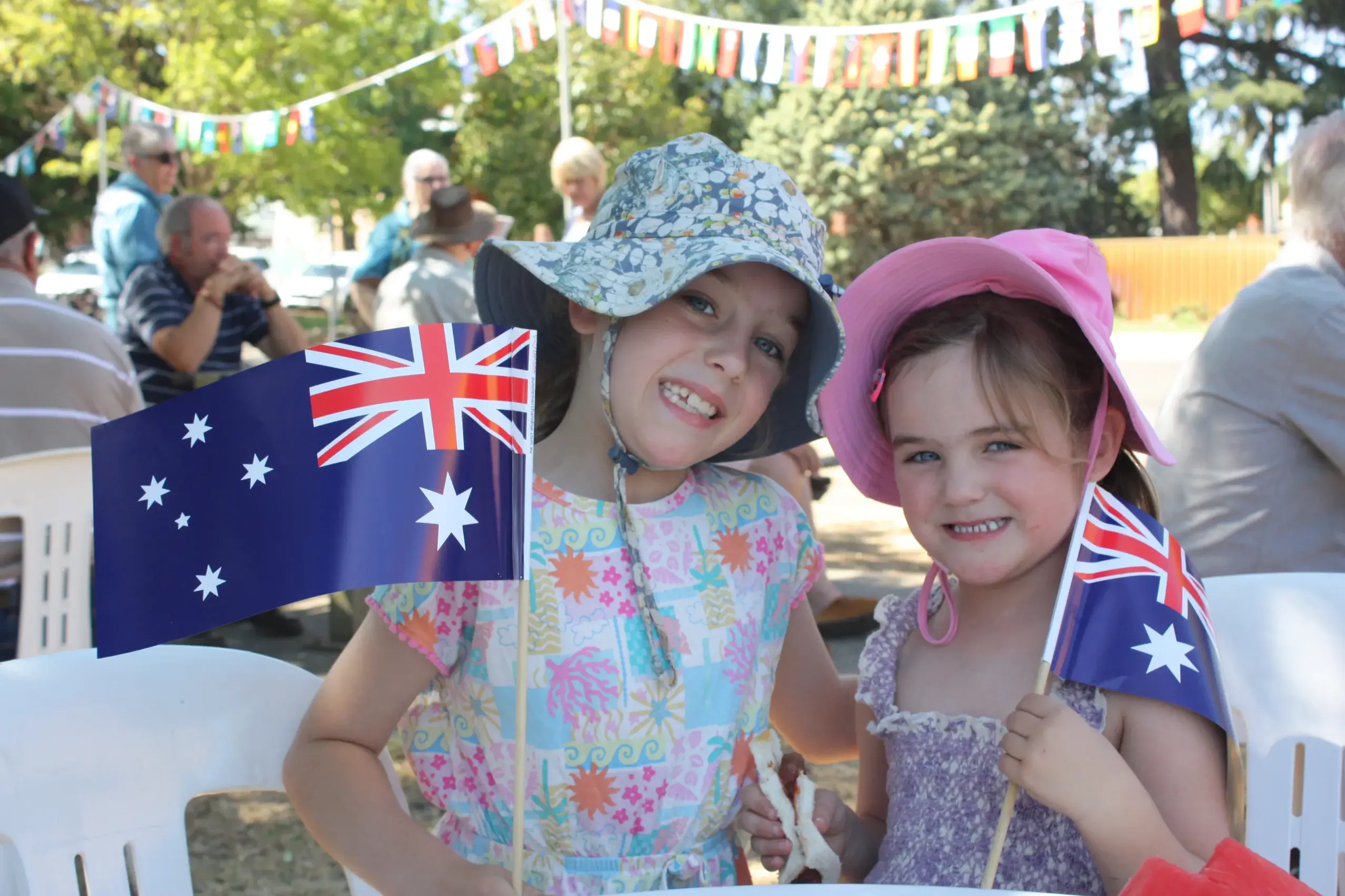<p>PRIDE AND JOY: Niamh and Eabha Mathieson waved the flag at the Lions Club barbeque at the Cathedral grounds on Australia Day, following the annual awards ceremony where some 300 people celebrated the community\\'s finest achievers in the Wangaratta Performing Arts and Convention Centre. PHOTOS: Bailey Zimmermann and Grace Fredsberg</p>\\n