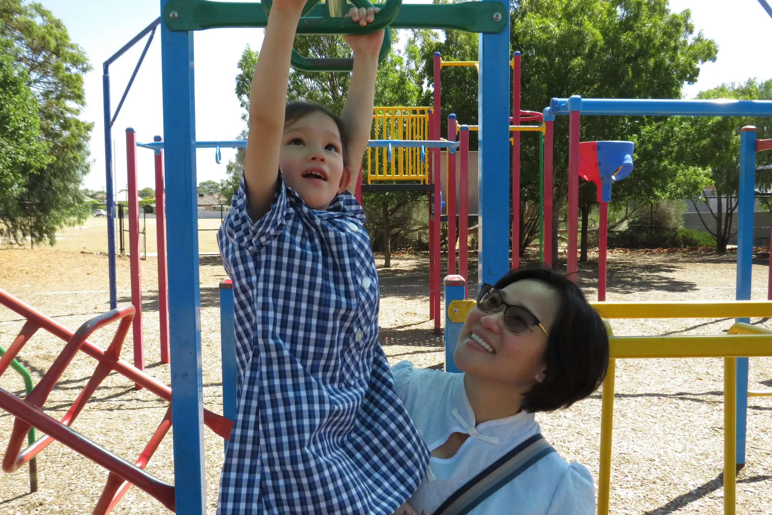 <p>REACHING FOR THE SKY: Penny Febvre, 5, checks out the playground at Wangaratta West Primary School ahead of her first day on Thursday, with mum Winnie Chang for support. PHOTO: Simone Kerwin</p>\\n