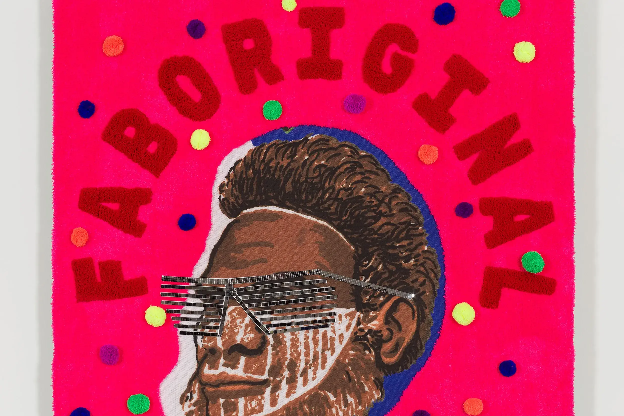 <p>DIVE DEEPER: The exhibition includes Kait James, Faboriginal, 2024, acrylic yarn, cotton, digital printed cotton, mirror tiles, felt, 150 x 140 x 10cm. Courtesy of the artist and Neon Parc. Photo: Christian Capurro</p>\\n