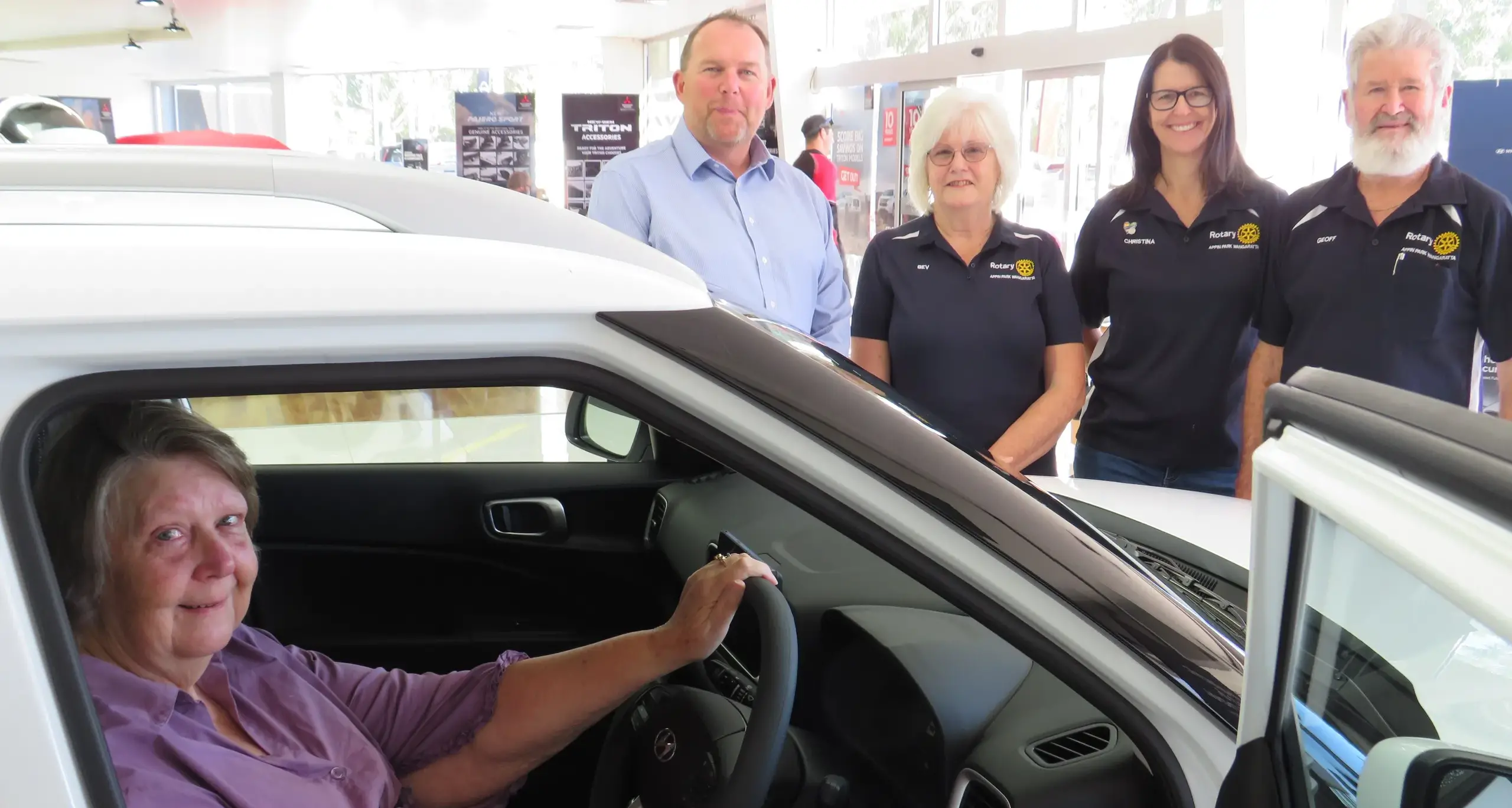 Community raffle winner collects new Hyundai