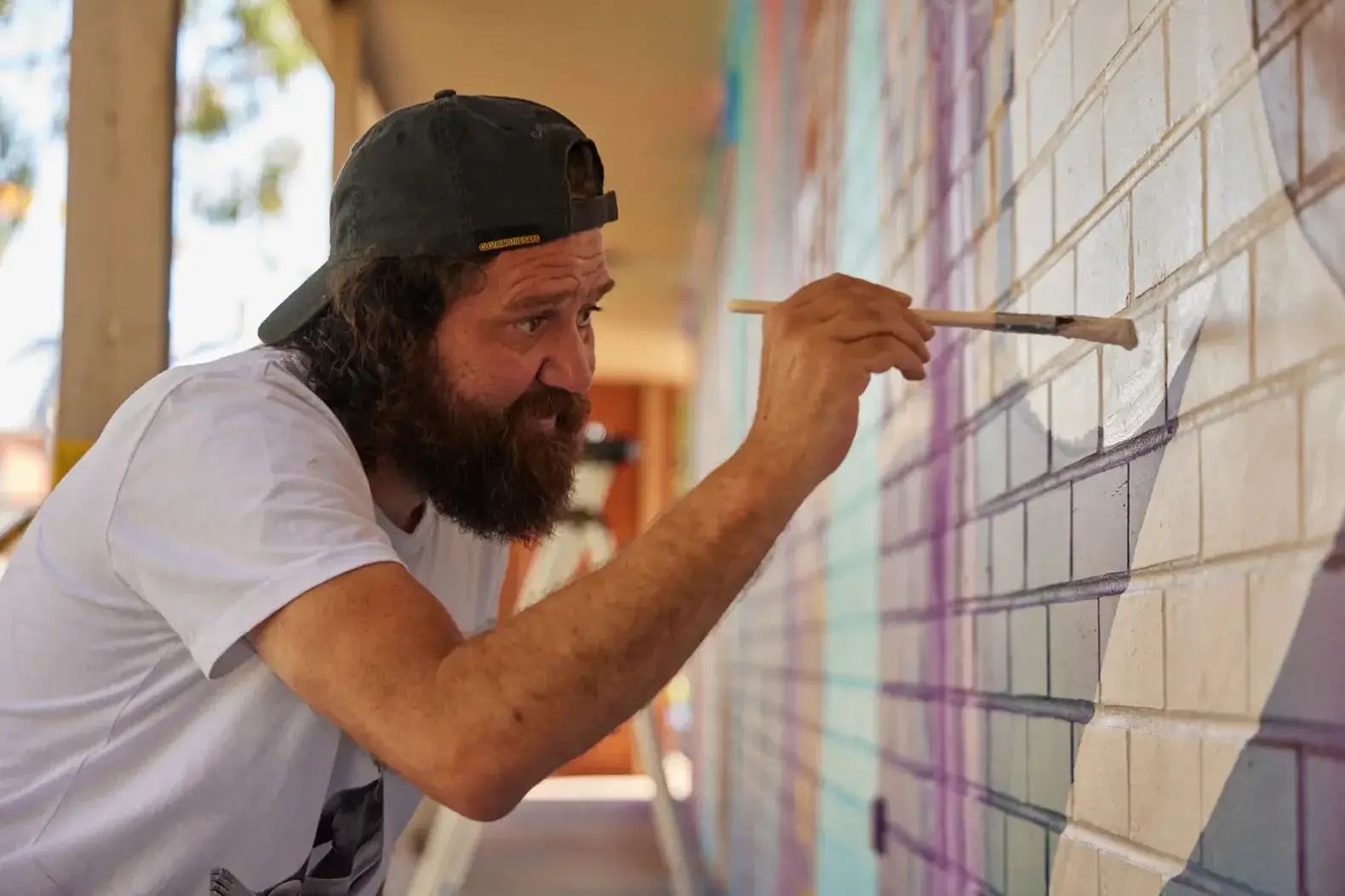 <p>CULTURE: Yorta Yorta artist Tommy Day will begin creating a First Nations artwork at the Wangaratta Railway Station underpass on Monday, 23 February. PHOTO: Courtesy Benalla Street Art Festival</p>\\n
