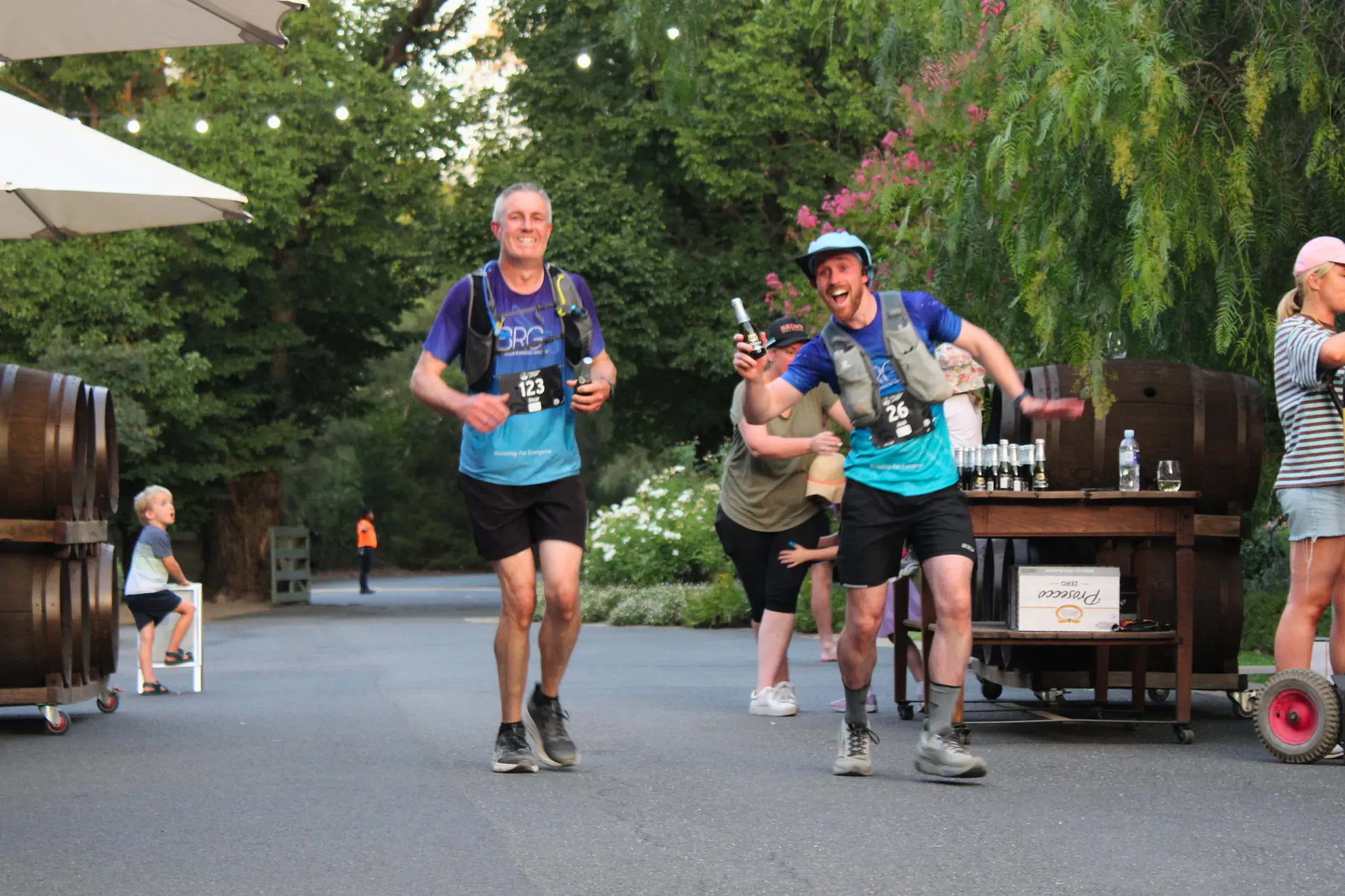 <p>A HARD-EARNED THIRST: Oscar Taylor and Josh Rankin (of Benalla Running Club) with Brown Brothers Prosecco Zero in hand (all finishers were offered a bottle of the non-alc wine as they approached the finish line).</p>\\n