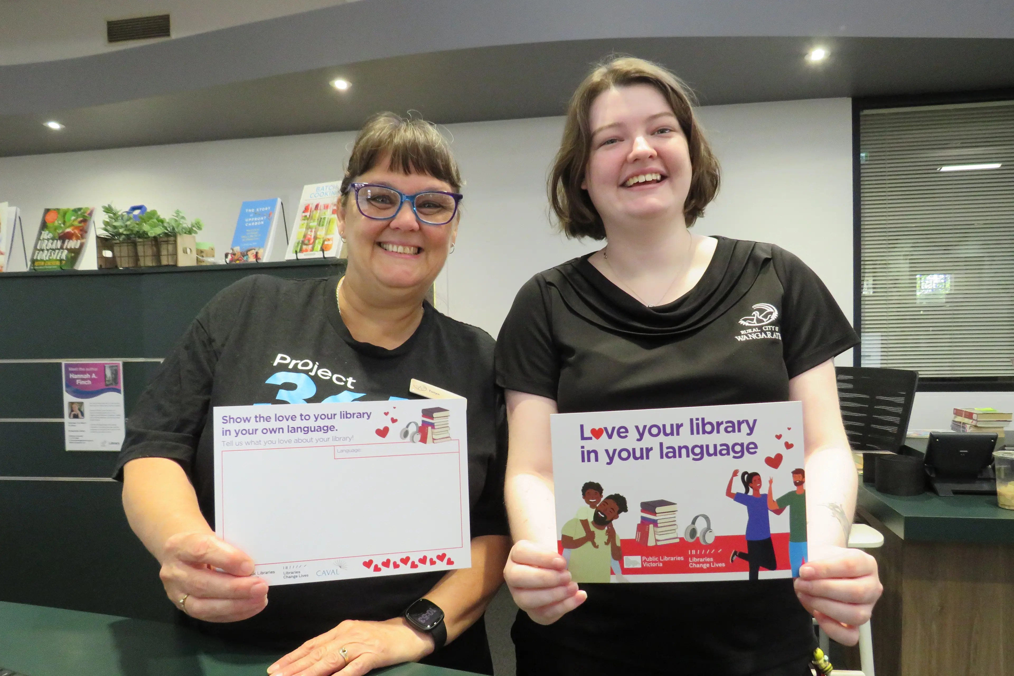 <p>LOVE LANGUAGE: Tanya Hopper and Peyton Williams from the Wangaratta Library show the \\'Love Your Library\\' postcards which are available for locals to fill with messages of appreciation for their library in their own language. PHOTO: Simone Kerwin </p>\\n