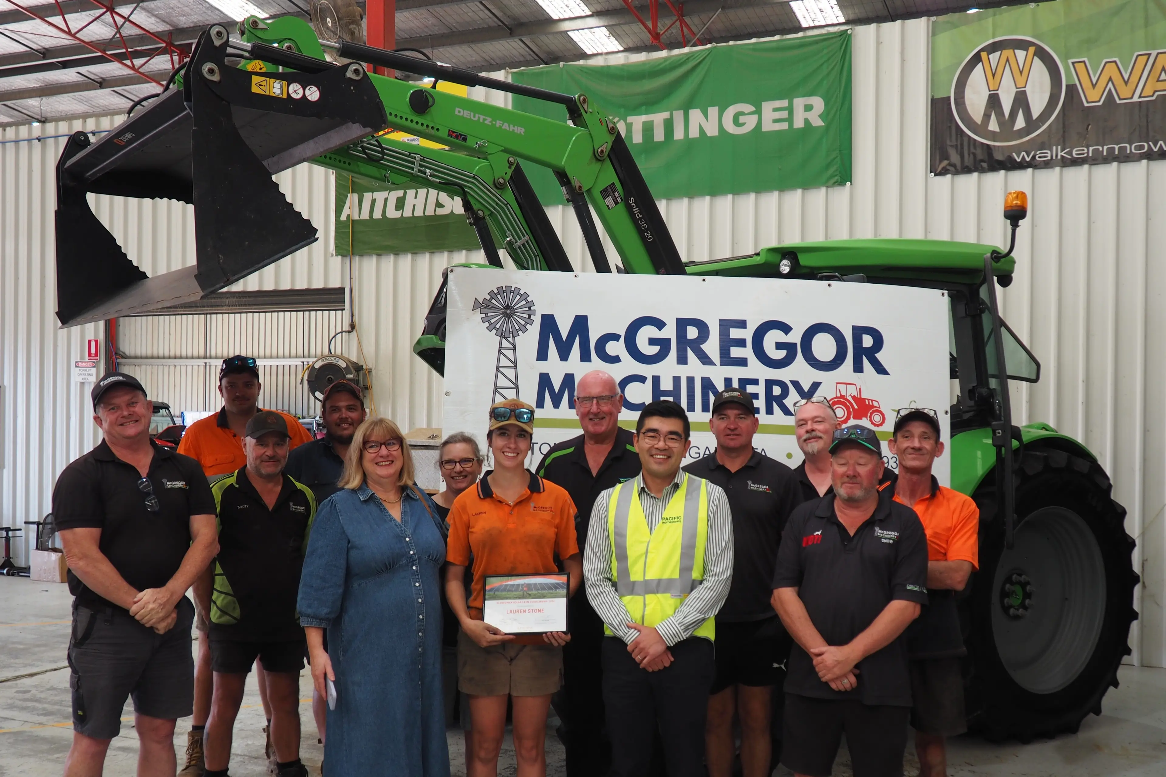<p>Pictured is the team from McGregor Machinery including (front row centre) scholarship recipient Lauren Stone next to her mum Sharron, Tim Oliver CEO NE Tracks LLEN, Michael Sun - delivery manager Pacific Partners, Glenrowan Solar Farm, McGregor Machinery dealer principal Brendan Breen, and service centre manager Benjamin Black.</p>\\n