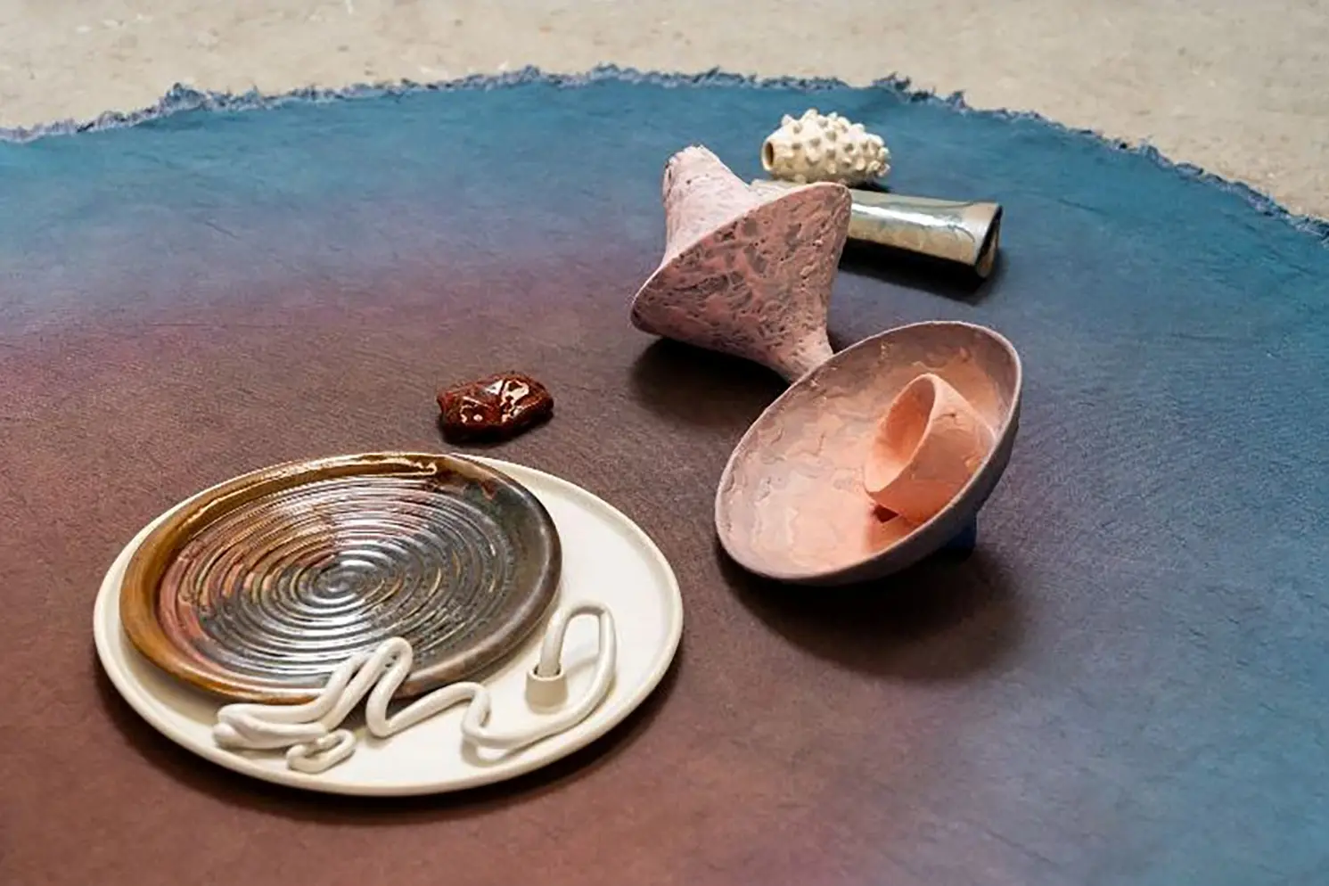 <p>TELLING OBJECTS: Affording Truth includes Tyza Hart, Expanding, 2026 (detail), stoneware, porcelain slip, glaze, cotton canvas, synthetic dye, 16 x 215 x 125cm. PHOTO: Louis Lim.</p>\\n