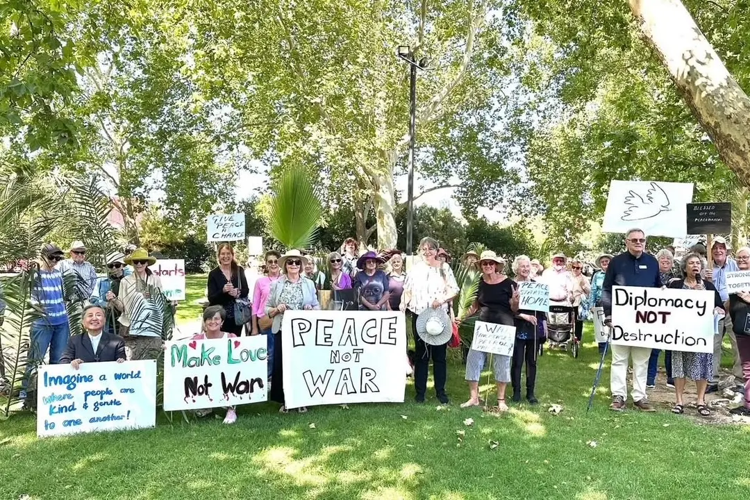 <p>RALLYING FOR PEACE: Participants of the Palm Sunday event gathered in the King George Gardens before walking a block of Wangaratta\\'s CBD.</p>\\n