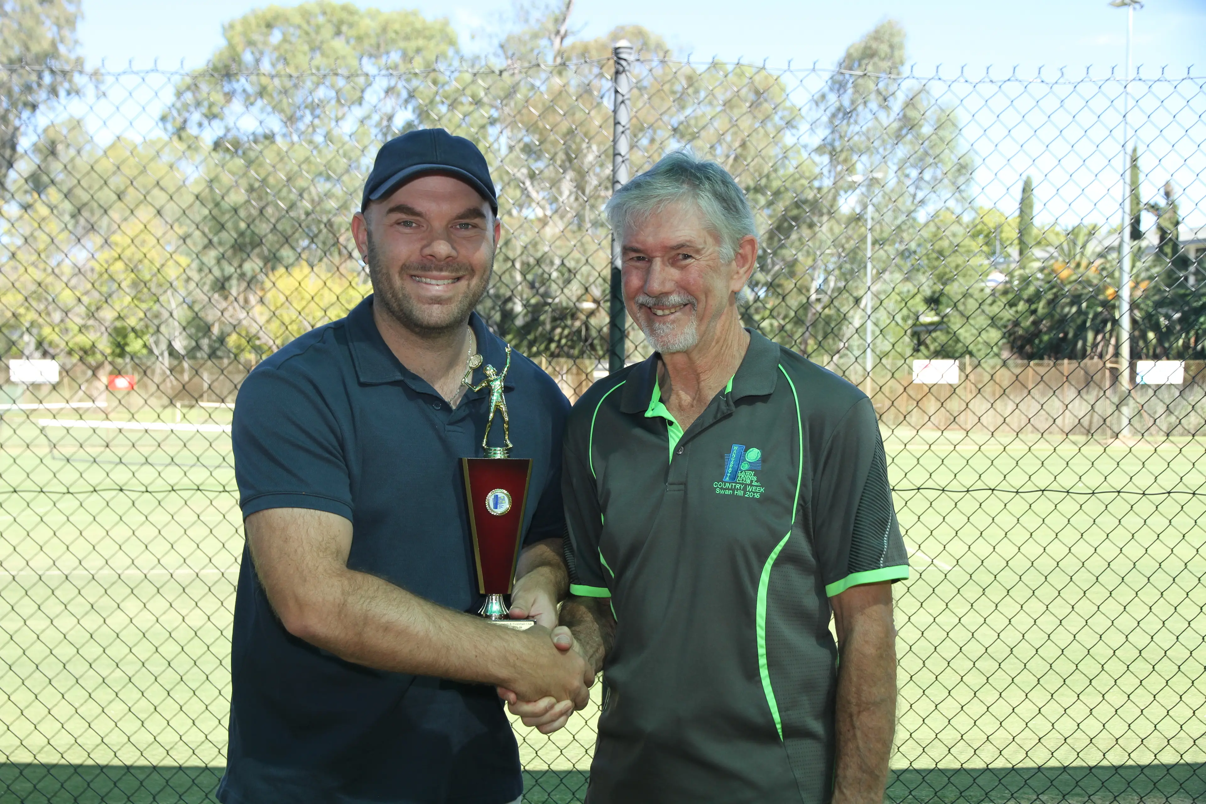 <p>WELL DONE: Ryan Patterson receives his award from WLTCP tournament director Frank Harris. </p>\\n