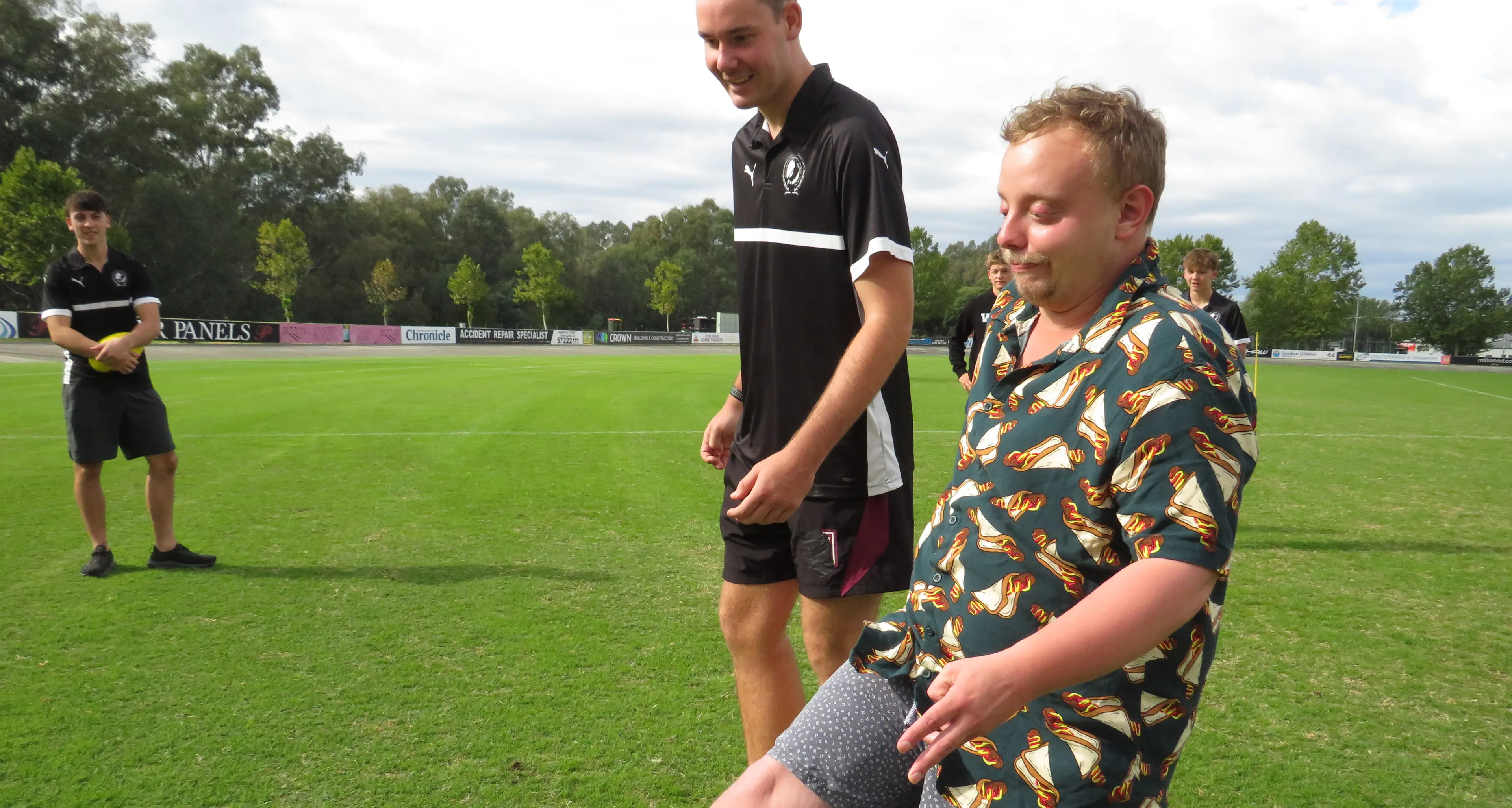 Giving footy a go, guided by Magpies' youth