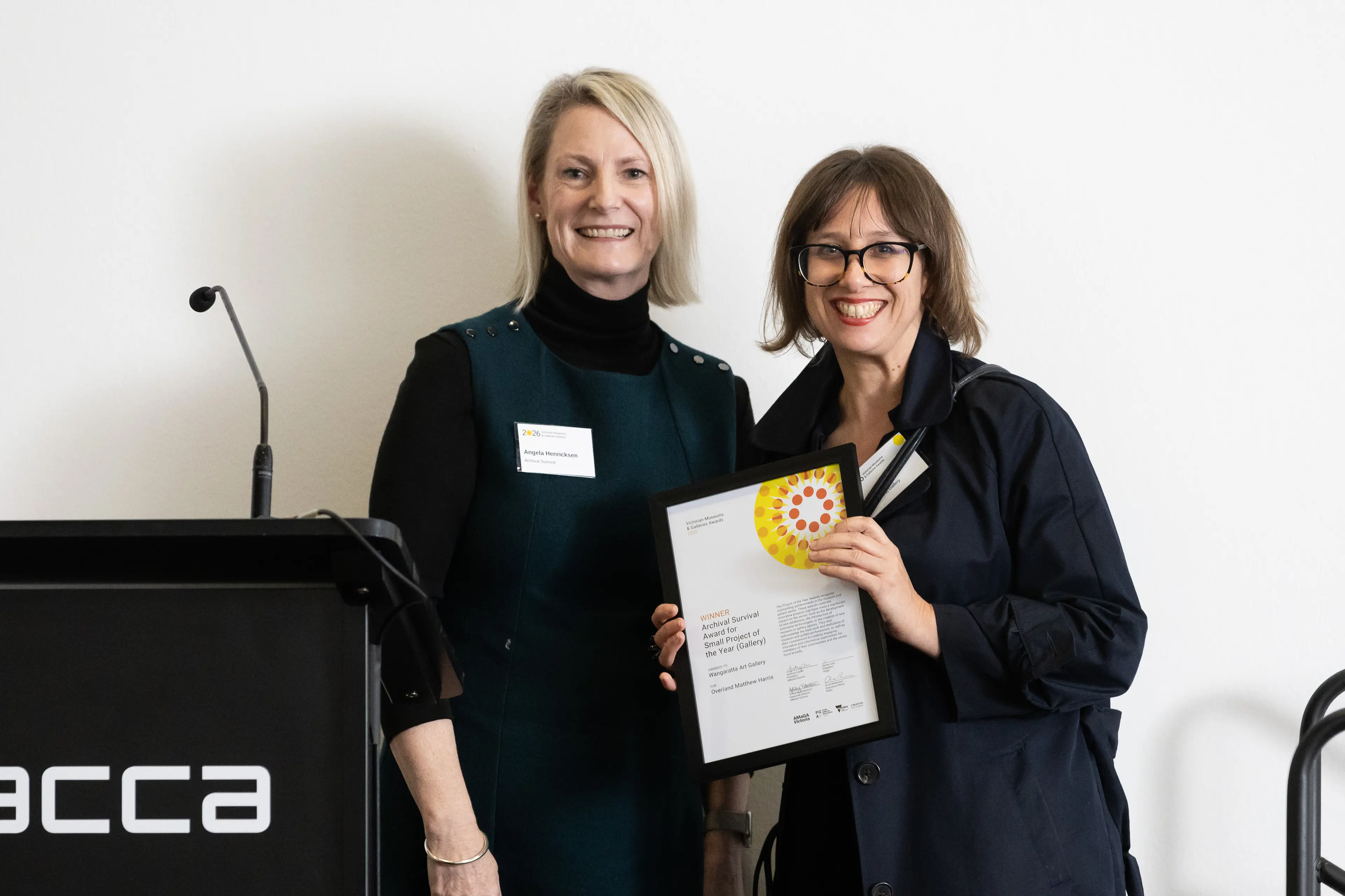 <p>TOP GONG: Angela Henricksen  (left) from Archival Survival who sponsored the award and Wangaratta Art Gallery director Rachel Arndt at the 2026 Victorian Museums and Galleries Award.</p>\\n