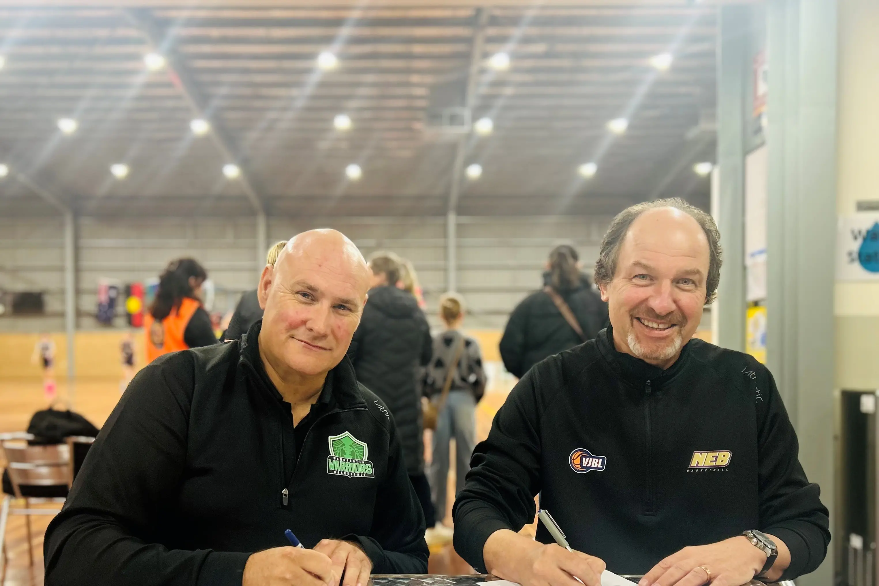 <p>ON THE SAME PAGE: North East Bushrangers president Matt Nelson (right) and Wangaratta Basketball Inc president Adam Maher sign a memorandum of understanding to further align the two organisations.</p>\\n