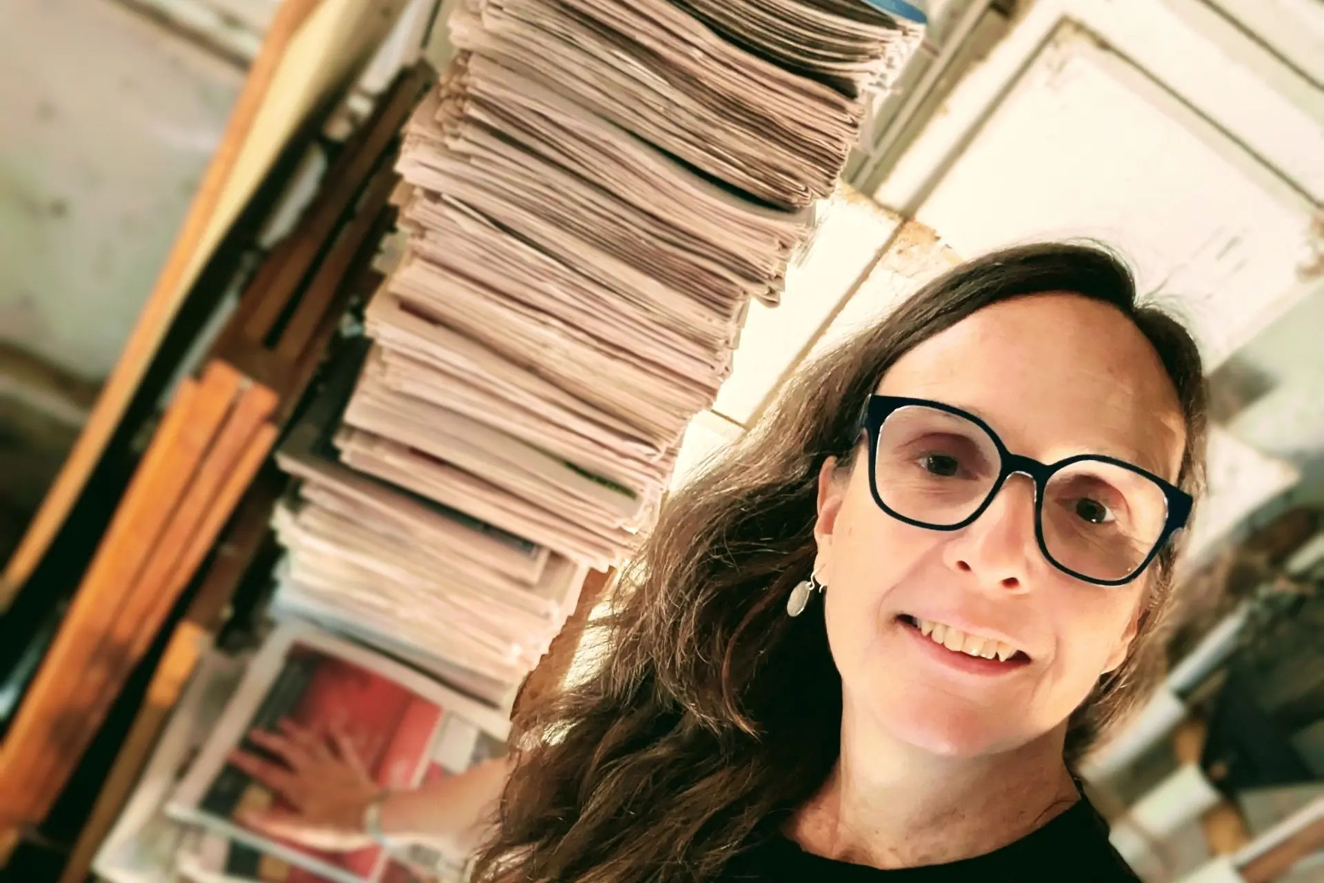 <p>STEEPED IN SUSTAINABILITY: Where possible, Bonny ensures she finds a purpose for items her clients let go, which can give clients some peace of mind during the decluttering process. The stack of newspapers from a client (pictured) have proven more than adequate for packing. </p>\\n
