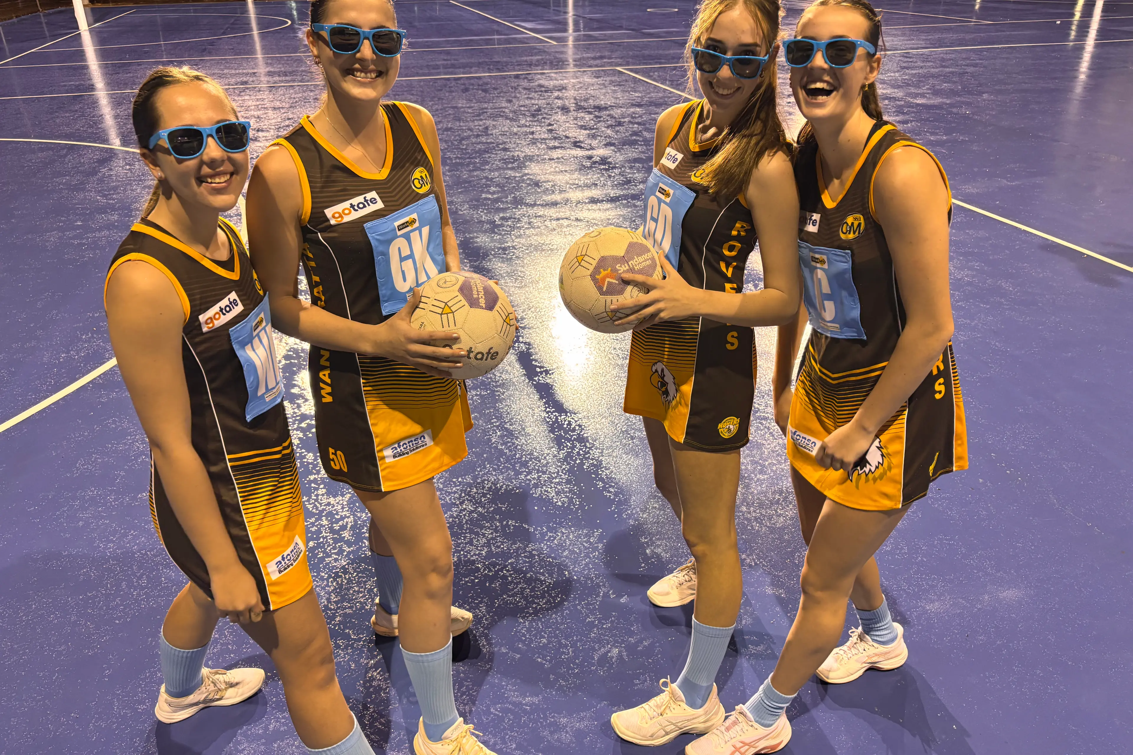 <p>THROWING A FIT: Rovers netballers Ellie Miler (left), Samantha Braithwaite, Lily Palmer and Holly McCarthy modelling the baby blue socks and bibs to be worn by players across the O&M this week for Terry Socks it to Cancer round.</p>\\n